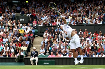LONDON, ENGLAND - JUNE 20:  Rafael Nadal of Spain serves during his first round match against Michael Russell of the United States on Day One of the Wimbledon Lawn Tennis Championships at the All England Lawn Tennis and Croquet Club on June 20, 2011 in Lo