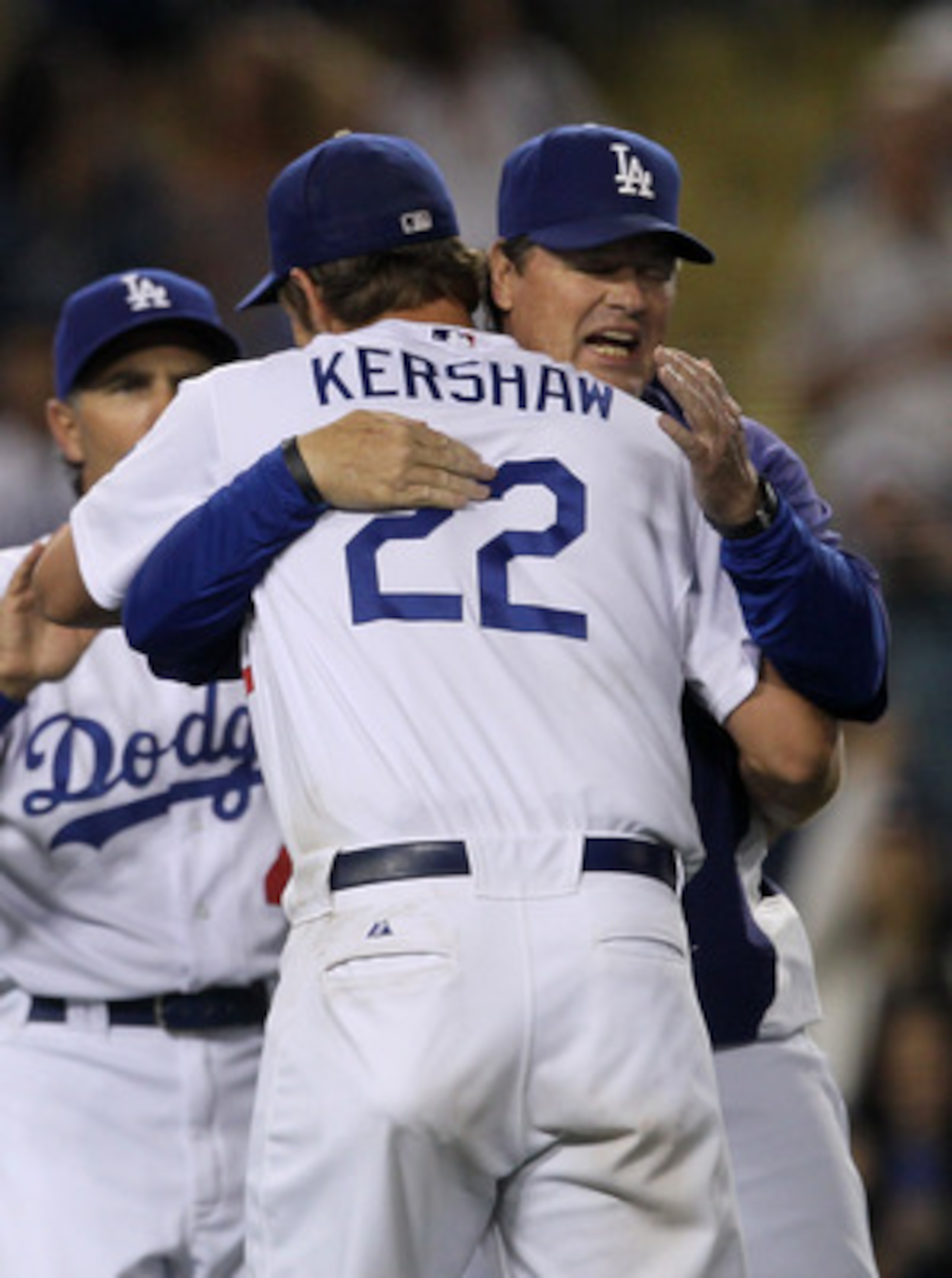 LOS ANGELES, CA - JUNE 20:  Pitching coach Rick Honeycutt hugs starting pitcher Clayton Kershaw #22 of the Los Angeles Dodgers after Kershaw's complete game shoutout against the Detroit Tigers on June 20, 2011 at Dodger Stadium in Los Angeles, California.