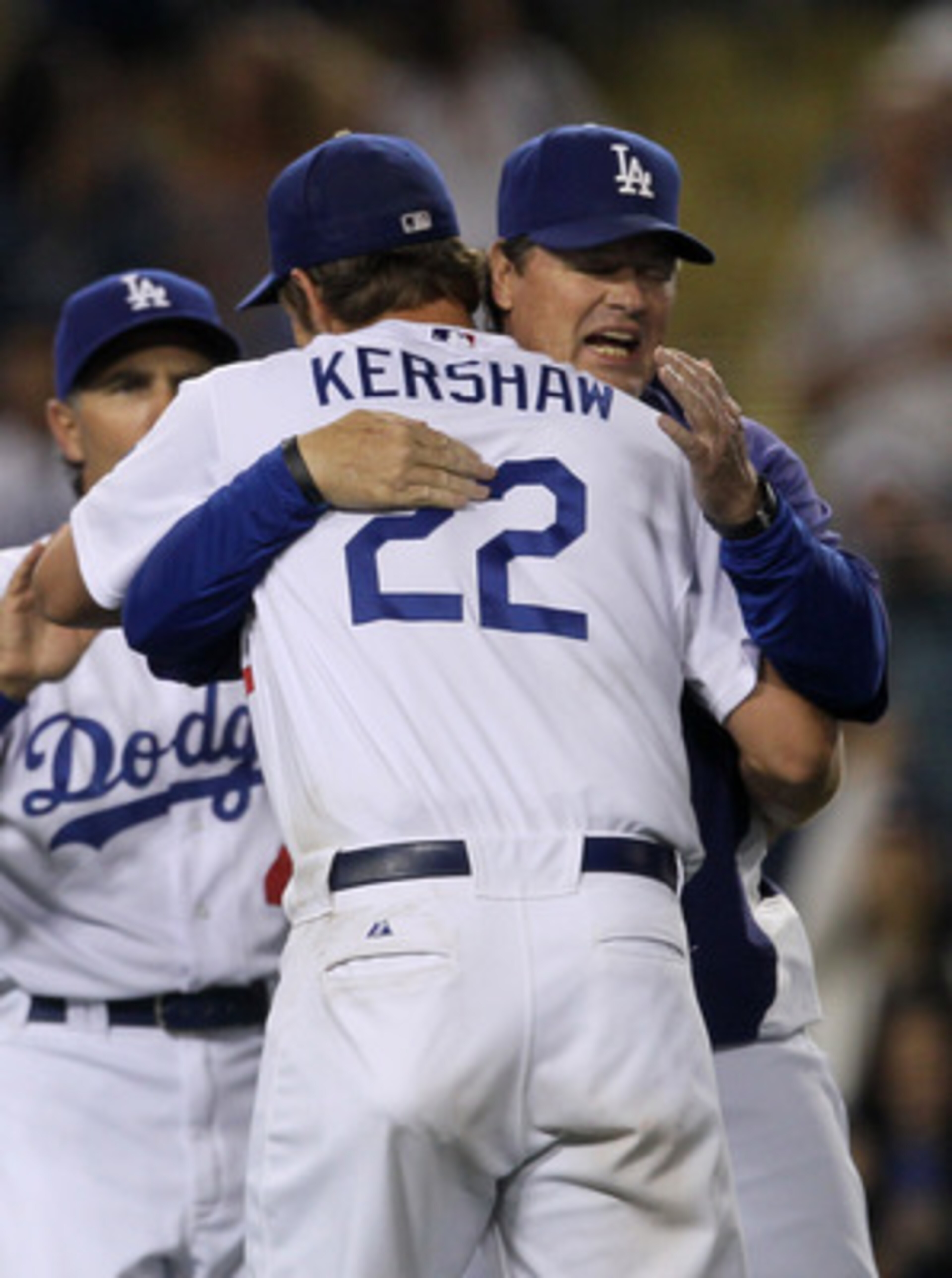 LOS ANGELES, CA - JUNE 20:  Pitching coach Rick Honeycutt hugs starting pitcher Clayton Kershaw #22 of the Los Angeles Dodgers after Kershaw's complete game shoutout against the Detroit Tigers on June 20, 2011 at Dodger Stadium in Los Angeles, California.
