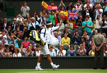LONDON, ENGLAND - JUNE 20:  Rafael Nadal of Spain walks onto centre court before his first round match against Michael Russell of the United States on Day One of the Wimbledon Lawn Tennis Championships at the All England Lawn Tennis and Croquet Club on Ju