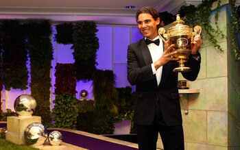 LONDON, ENGLAND - JULY 04: Rafael Nadal of Spain arrives with the winners trophy at the Wimbledon Championships 2010 Winners Ball at the InterContinental Park Lane Hotel on July 4, 2010 in London, England.  (Photo by Julian Finney/Getty Images)