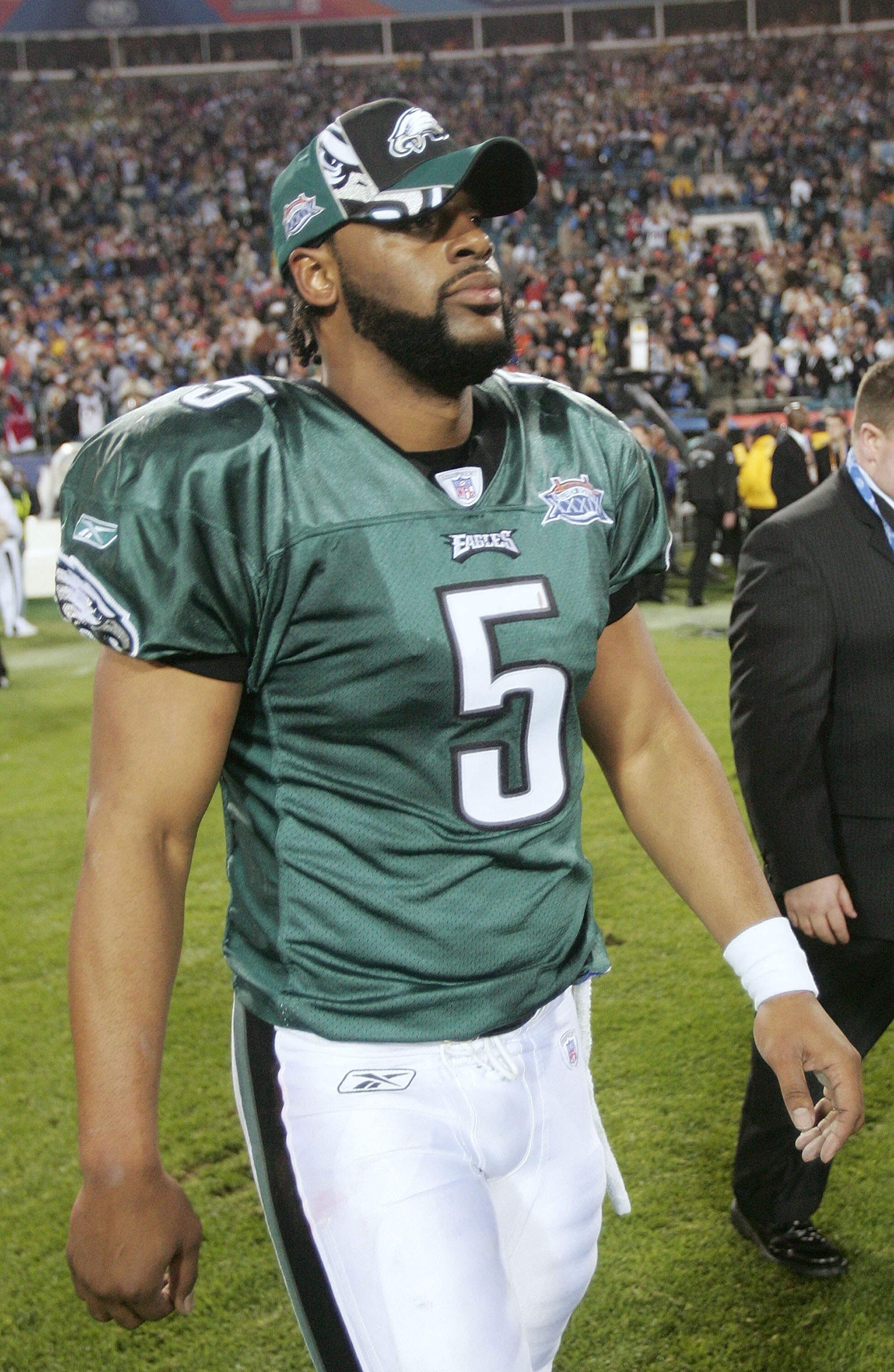 JACKSONVILLE, FLORIDA - FEBRUARY 06:  Quarterback Donovan McNabb #5 of the Philadelphia Eagles walks off the field after the New England Patriots win 24-21 in Superbowl XXXIX at Alltel Stadium on February 6, 2005 in Jacksonville, Florida.  (Photo by Jed J