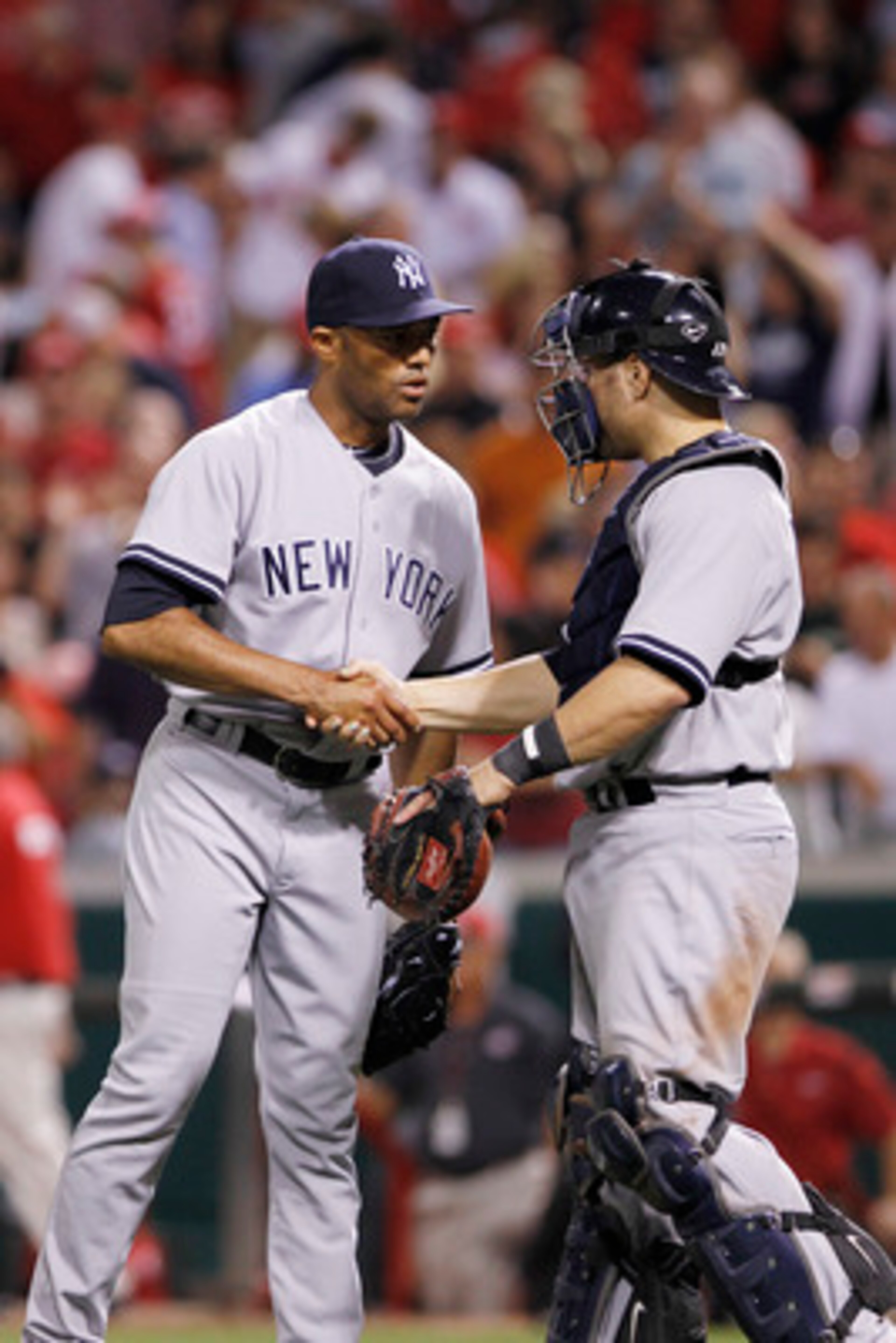 CINCINNATI, OH - JUNE 20: Mariano Rivera #42 and Russell Martin #55 of the New York Yankees shake hands after the game against the Cincinnati Reds at Great American Ball Park on June 20, 2011 in Cincinnati, Ohio. The Yankees defeated the Reds 5-3. (Photo