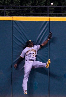 CLEVELAND, OH - JUNE 18:   Andrew McCutchen #22 of the Pittsburgh Pirates is unable to make the play on a ball hit for a triple by Grady Sizemore #24 of the Cleveland Indians during the seventh  inning of their game on June 18, 2011 at Progressive Field i