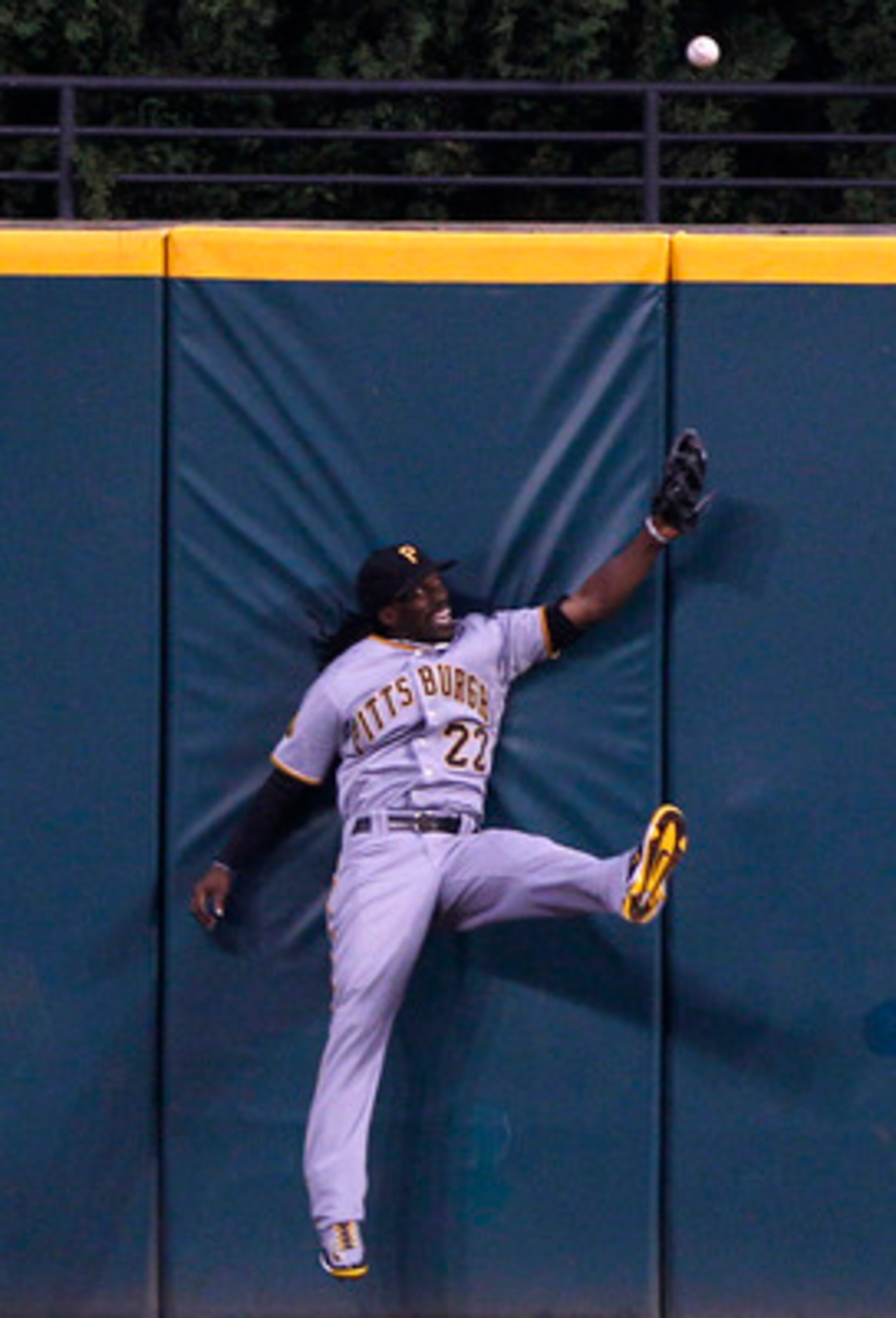CLEVELAND, OH - JUNE 18:   Andrew McCutchen #22 of the Pittsburgh Pirates is unable to make the play on a ball hit for a triple by Grady Sizemore #24 of the Cleveland Indians during the seventh  inning of their game on June 18, 2011 at Progressive Field i