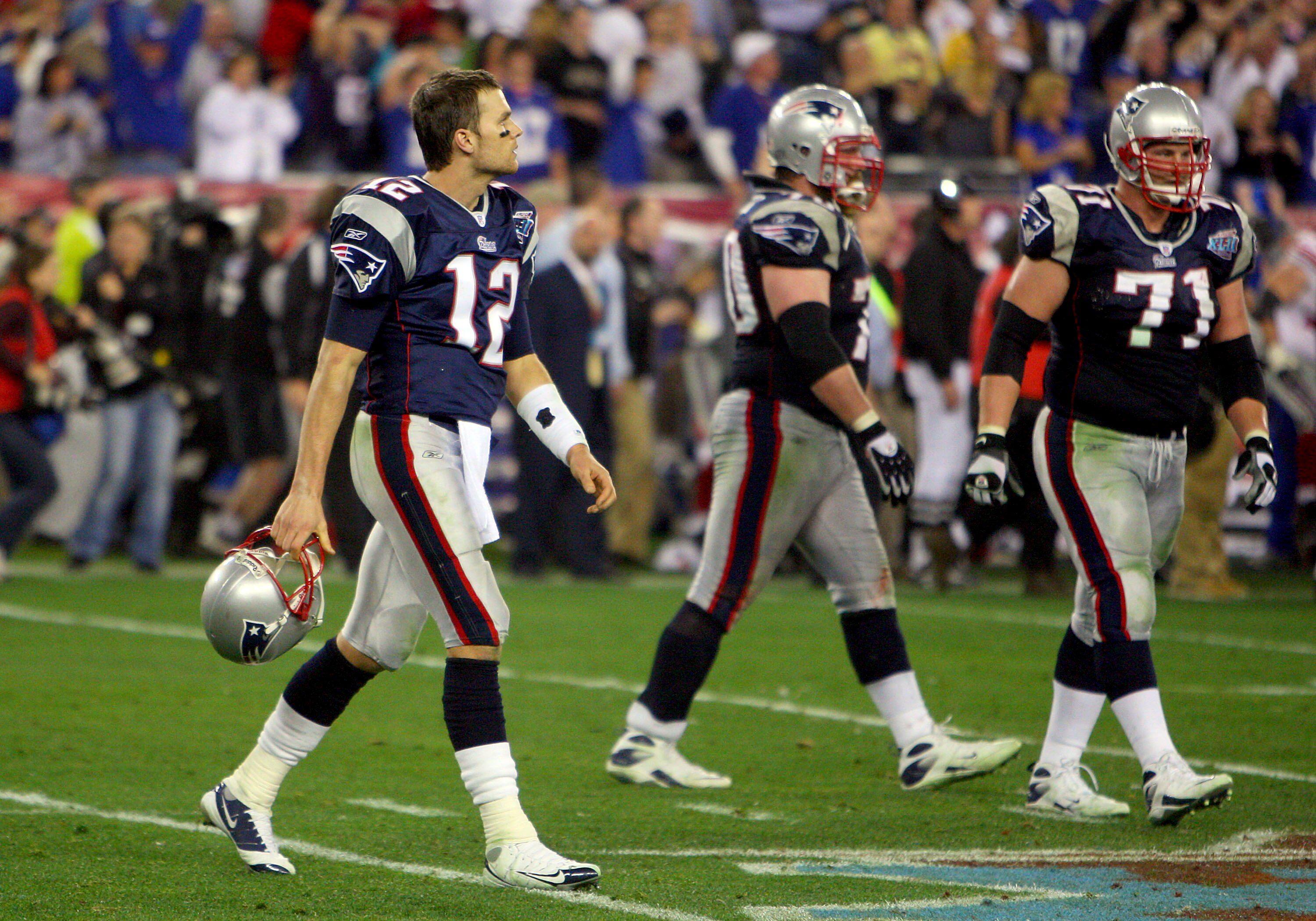 GLENDALE, AZ - FEBRUARY 03:  Tom Brady #12 of the New England Patriots walks off the field during Super Bowl XLII against the New York Giants on February 3, 2008 at the University of Phoenix Stadium in Glendale, Arizona.  (Photo by Donald Miralle/Getty Im