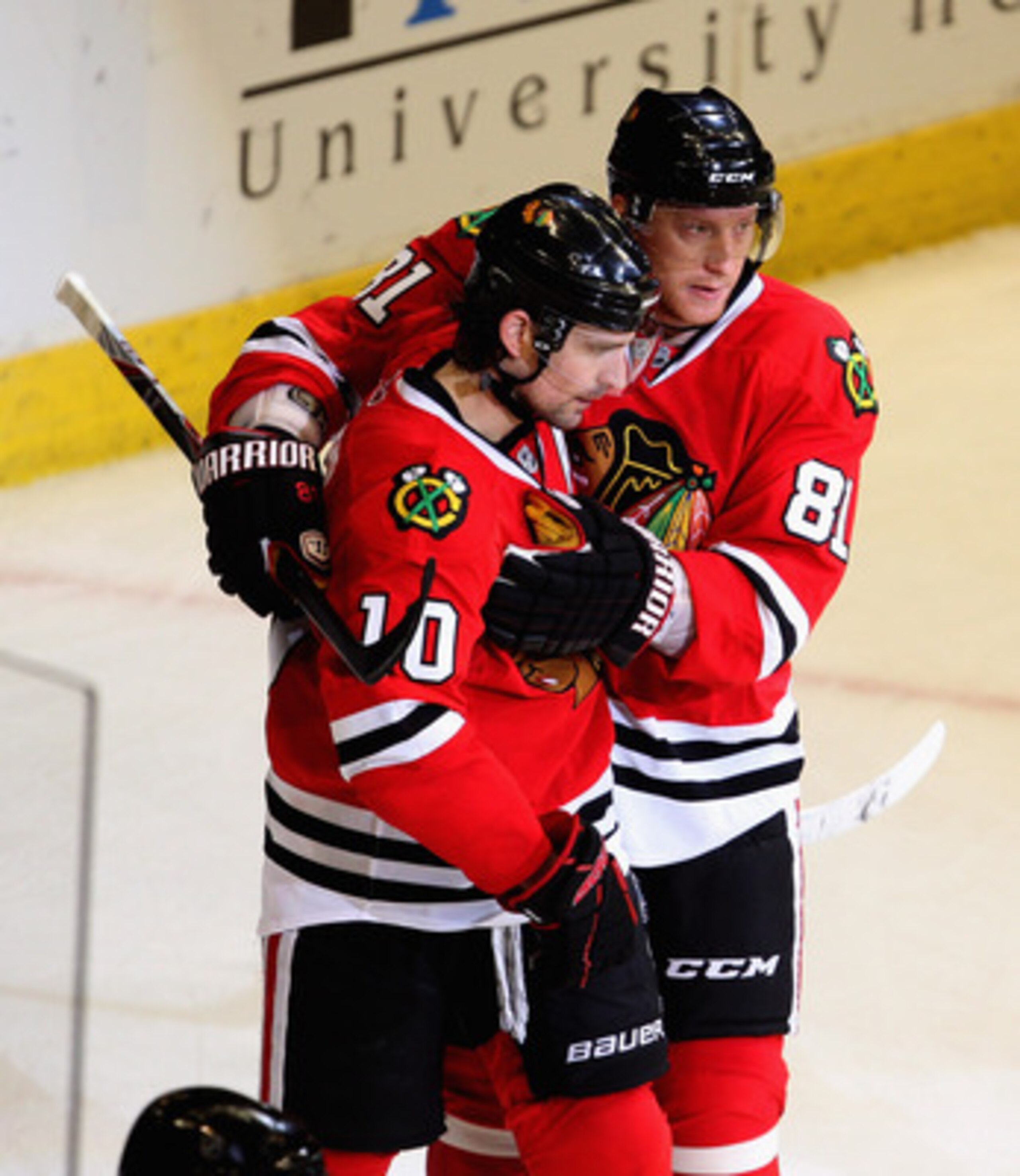 CHICAGO, IL - APRIL 19: Marian Hossa #81 of the Chicago Blackhawks congratulates teammate Patrick Sharp #10 after Sharp scored his second goal of the game against the Vancouver Canucks in Game Four of the Western Conference Quarterfinals during the 2011 N