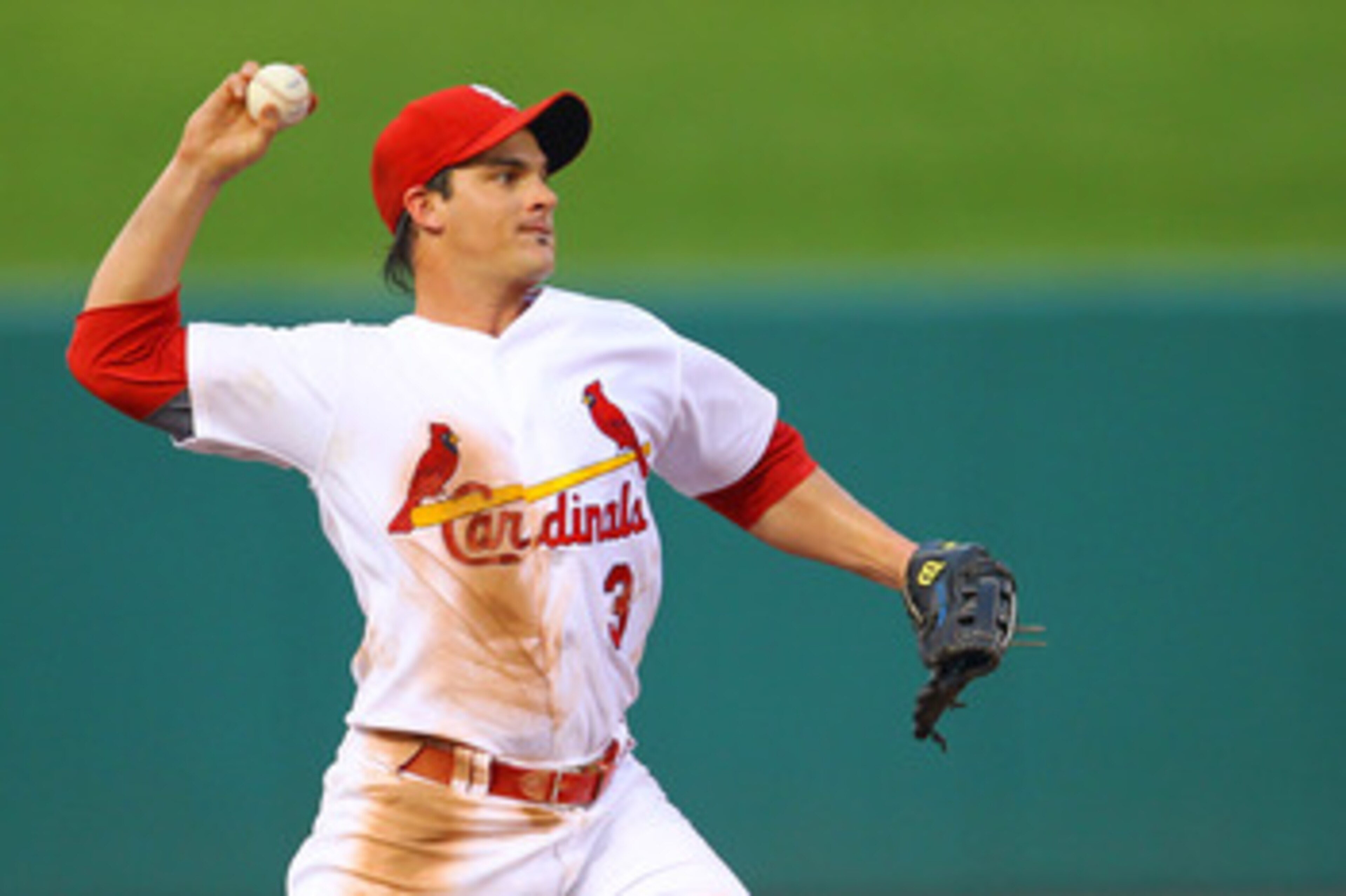 ST. LOUIS, MO - JUNE 3: Ryan Theriot #3 of the St. Louis Cardinals throws to first base against the Chicago Cubs at Busch Stadium on June 3, 2011 in St. Louis, Missouri.  (Photo by Dilip Vishwanat/Getty Images)