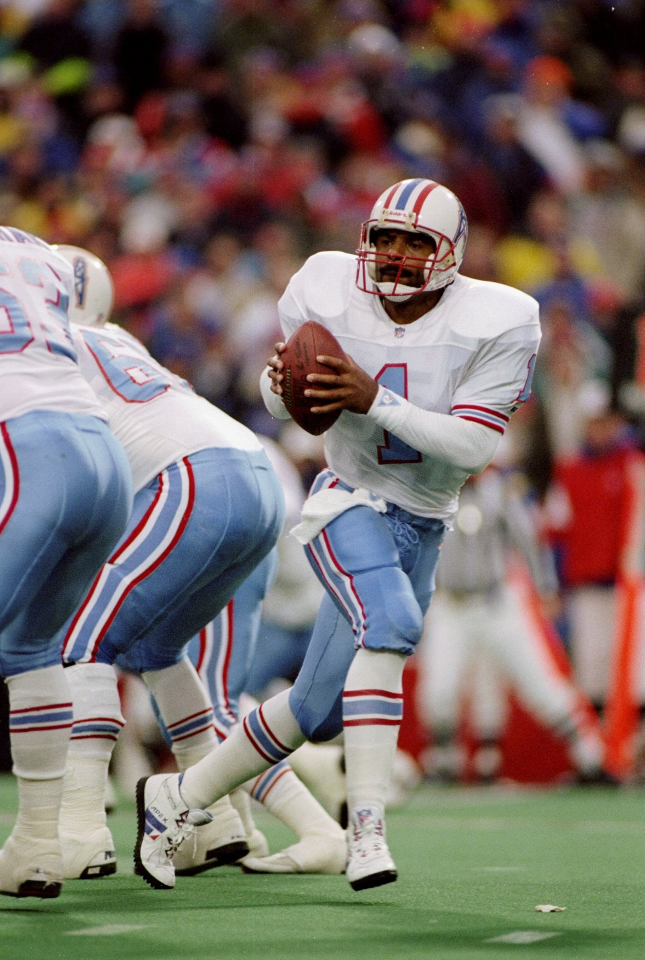 3 Jan 1993:  Quarterback Warren Moon of the Houston Oilers scrambles with the ball during a game against the Buffalo Bills at Rich Stadium in Orchard Park, New York.  The Bills won the game 41-38. Mandatory Credit: Rick Stewart  /Allsport