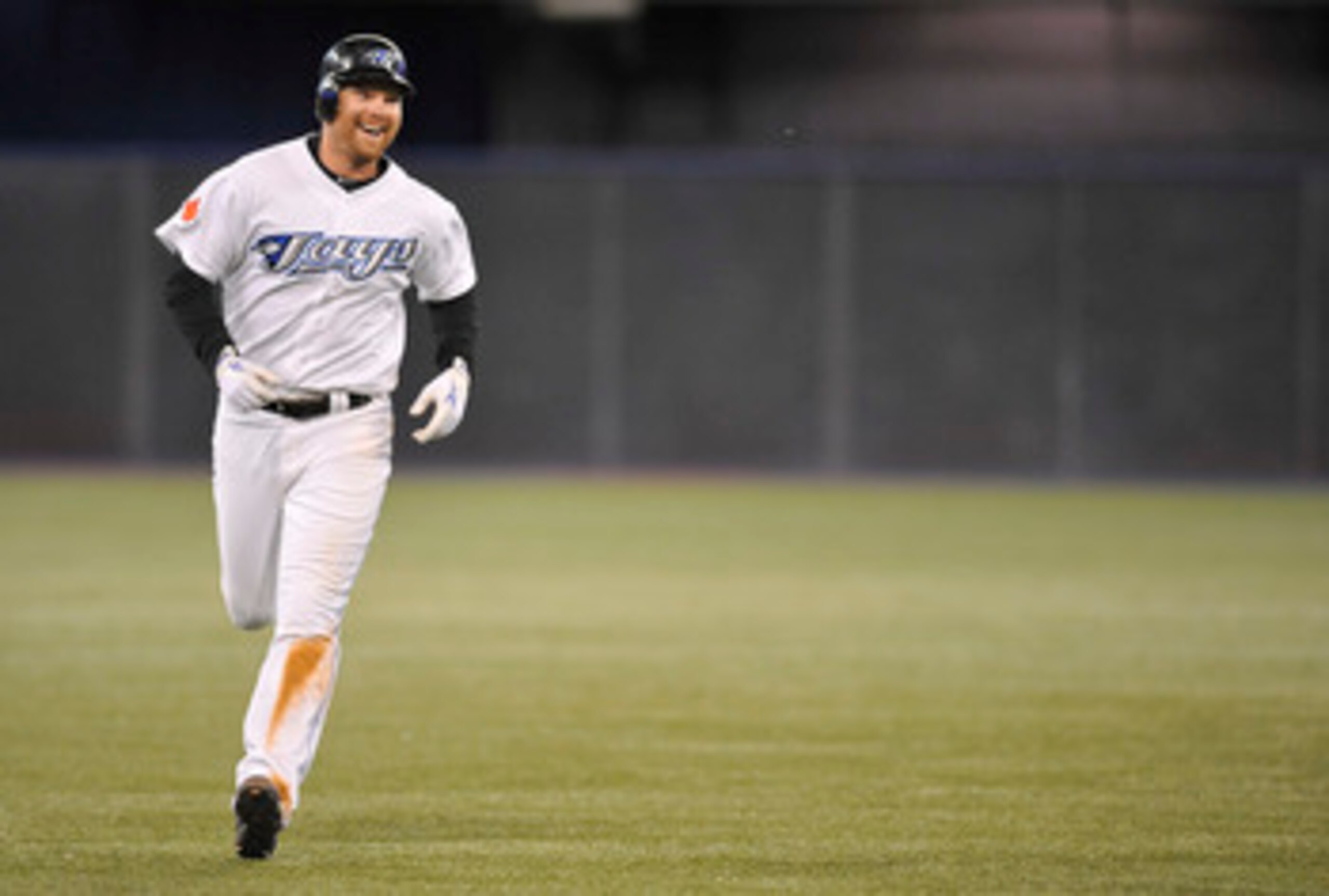 TORONTO, CANADA - JUNE 14:  Adam Lind #26 of the Toronto Blue Jays is all smiles after hitting a walk of home run against the Baltimore Orioles June 14, 2011 at Rogers Centre in Toronto, Ontario, Canada. (Photo by Brad White/Getty Images)