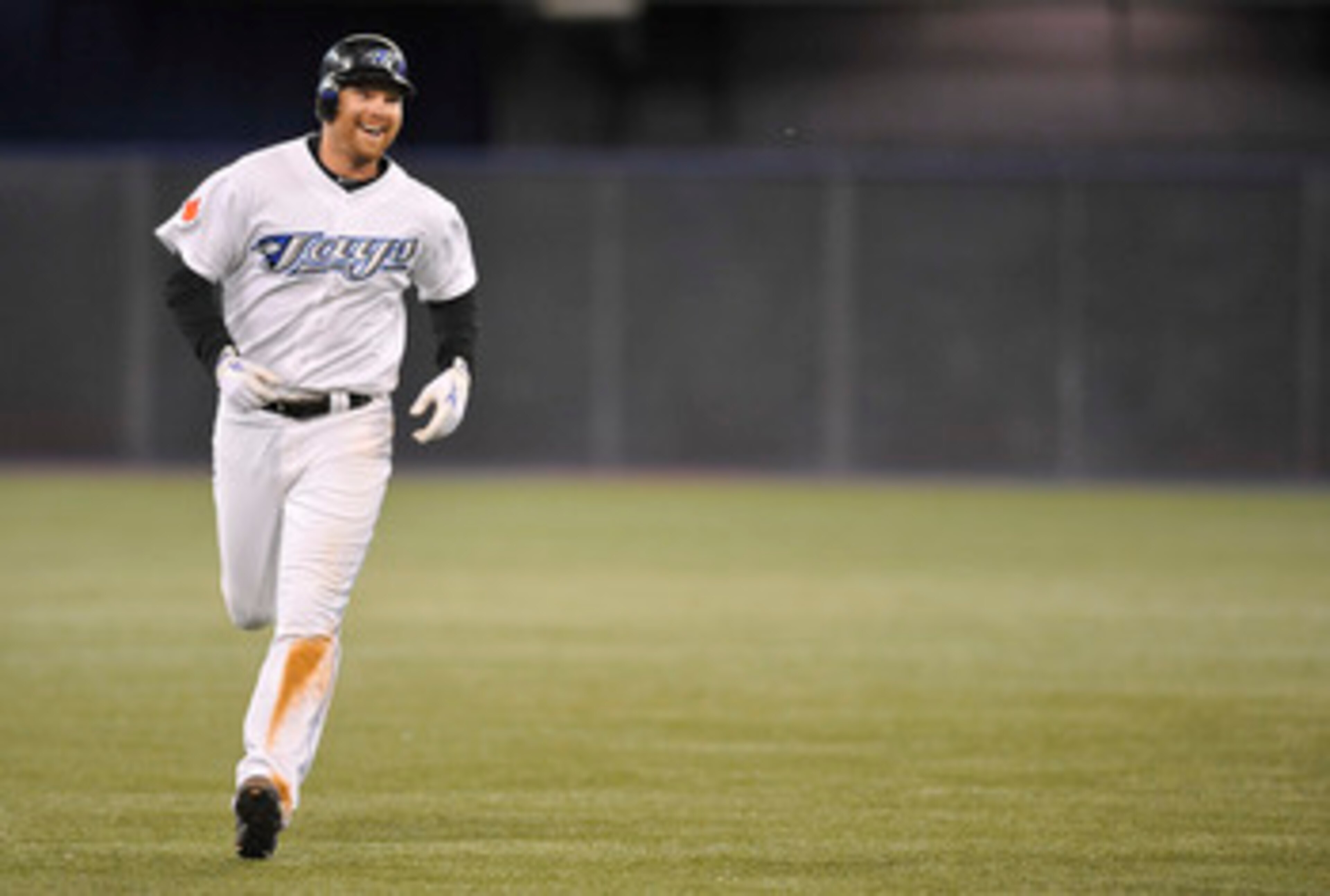 TORONTO, CANADA - JUNE 14:  Adam Lind #26 of the Toronto Blue Jays is all smiles after hitting a walk of home run against the Baltimore Orioles June 14, 2011 at Rogers Centre in Toronto, Ontario, Canada. (Photo by Brad White/Getty Images)