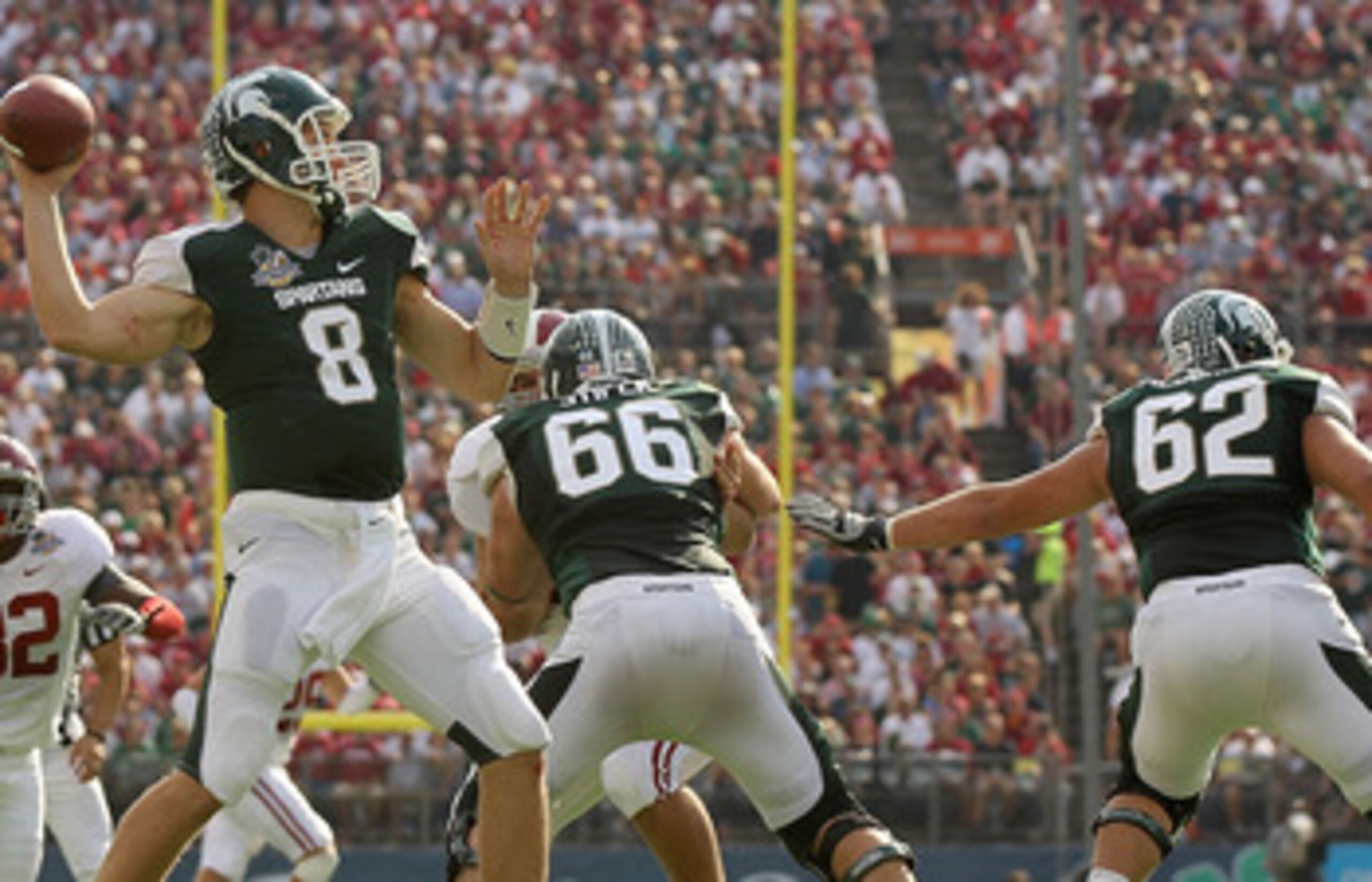ORLANDO, FL - JANUARY 01:  Kirk Cousins #8 of the Michigan State Spartans passes the ball during the Capitol One Bowl against the Alabama Crimson Tide at the Florida Citrus Bowl on January 1, 2011 in Orlando, Florida.  (Photo by Mike Ehrmann/Getty Images)