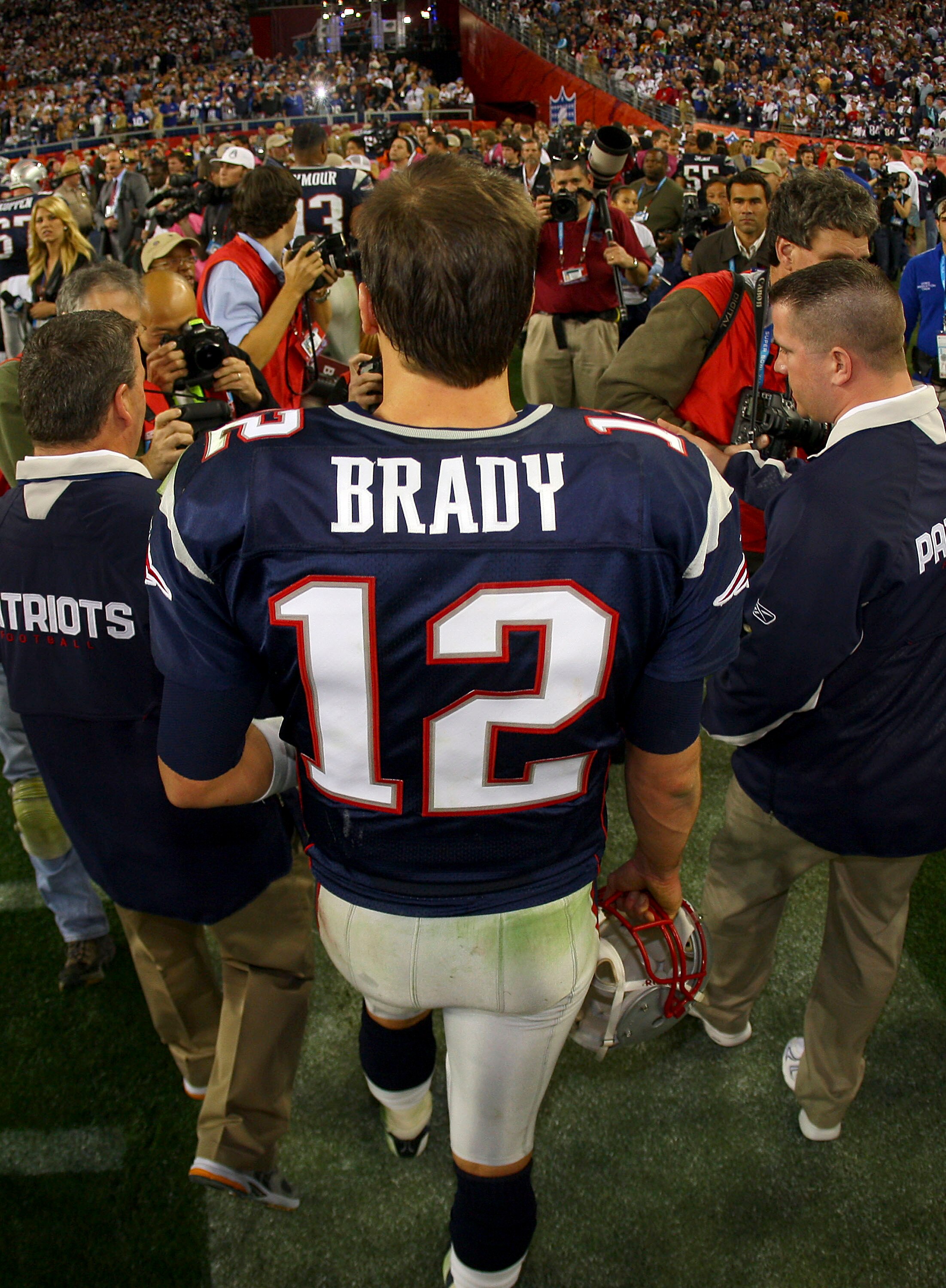 GLENDALE, AZ - FEBRUARY 03:  Tom Brady #12 of the New England Patriots, walks off the field after losing to the New York Giants 17-14 in Super Bowl XLII on February 3, 2008 at the University of Phoenix Stadium in Glendale, Arizona.  (Photo by Donald Miral