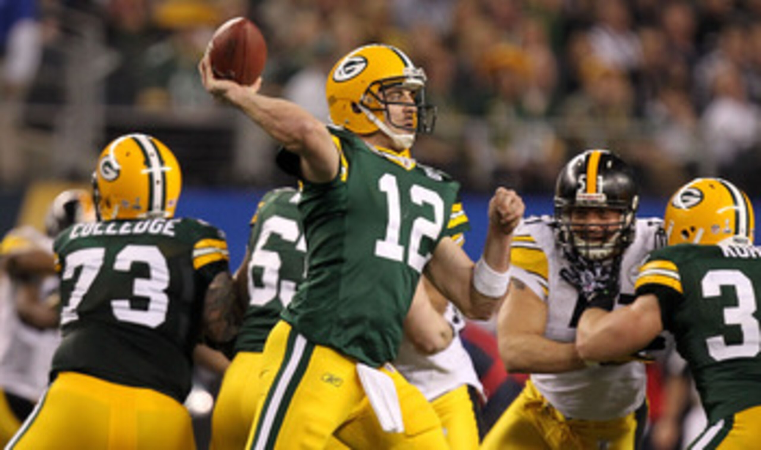 ARLINGTON, TX - FEBRUARY 06:  Aaron Rodgers #12 of the Green Bay Packers throws a pass against the Pittsburgh Steelers during Super Bowl XLV at Cowboys Stadium on February 6, 2011 in Arlington, Texas.  (Photo by Ronald Martinez/Getty Images)