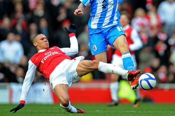 LONDON, ENGLAND - JANUARY 30:  Anthony Pilkington of Huddersfield is tackled by Kieran Gibbs of Arsenal during the FA Cup sponsored by E.ON fourth round match between Arsenal and Huddersfield Town at The Emirates Stadium on January 30, 2011 in London, Eng