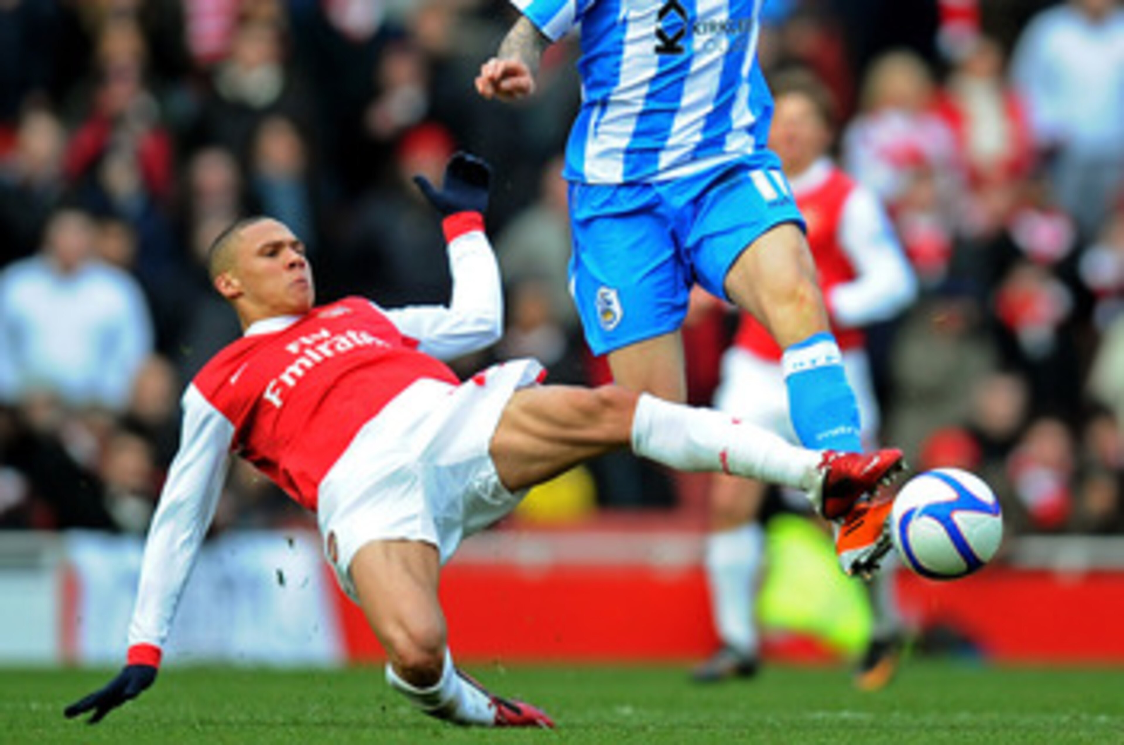 LONDON, ENGLAND - JANUARY 30:  Anthony Pilkington of Huddersfield is tackled by Kieran Gibbs of Arsenal during the FA Cup sponsored by E.ON fourth round match between Arsenal and Huddersfield Town at The Emirates Stadium on January 30, 2011 in London, Eng
