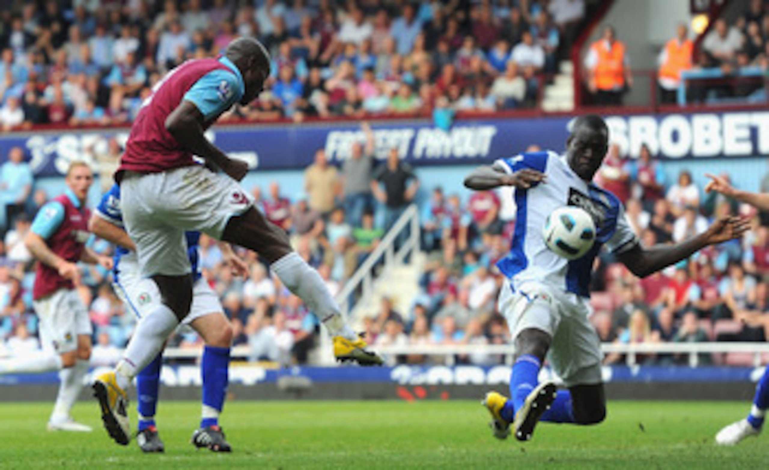 LONDON, ENGLAND - MAY 07:  Carlton Cole of West Ham United has his shot blocked by Christopher Samba of Blackburn Rovers during the Barclays Premier League match between West Ham United and Blackburn Rovers at the Boleyn Ground on May 7, 2011 in London, E