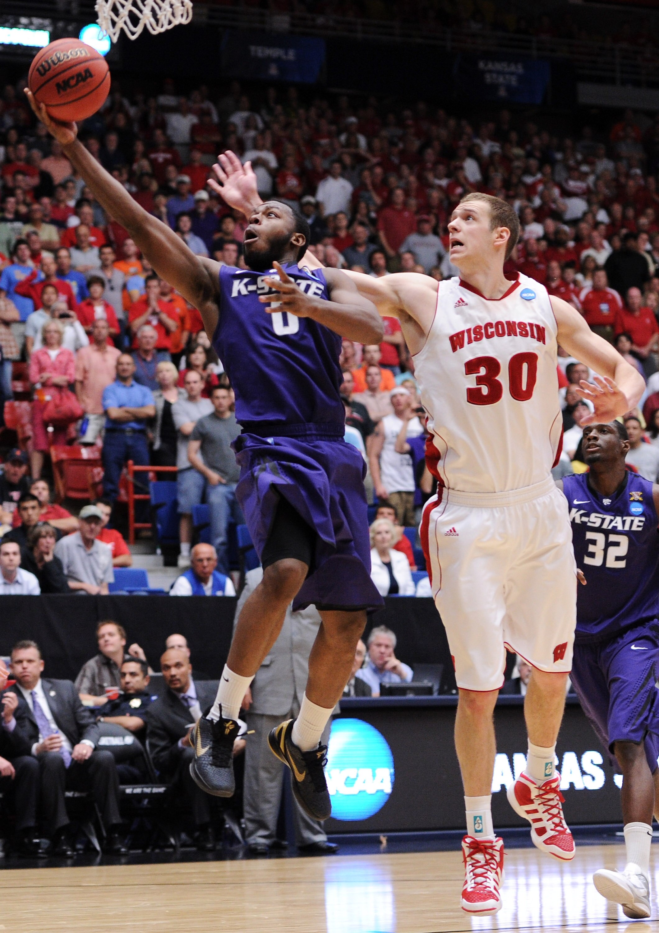 TUCSON, AZ - MARCH 19: Jacob Pullen #0 of the Kansas State Wildcats shoots past Jon Leuer #30 of the Wisconsin Badgers during the third round of the 2011 NCAA men's basketball tournament at McKale Center on March 19, 2011 in Tucson, Arizona. (Photo by H TUCSON, AZ - MARCH 19: Jacob Pullen #0 of the Kansas State Wildcats shoots past Jon Leuer #30 of the Wisconsin Badgers during the third round of the 2011 NCAA men's basketball tournament at McKale Center on March 19, 2011 in Tucson, Arizona. (Photo by H