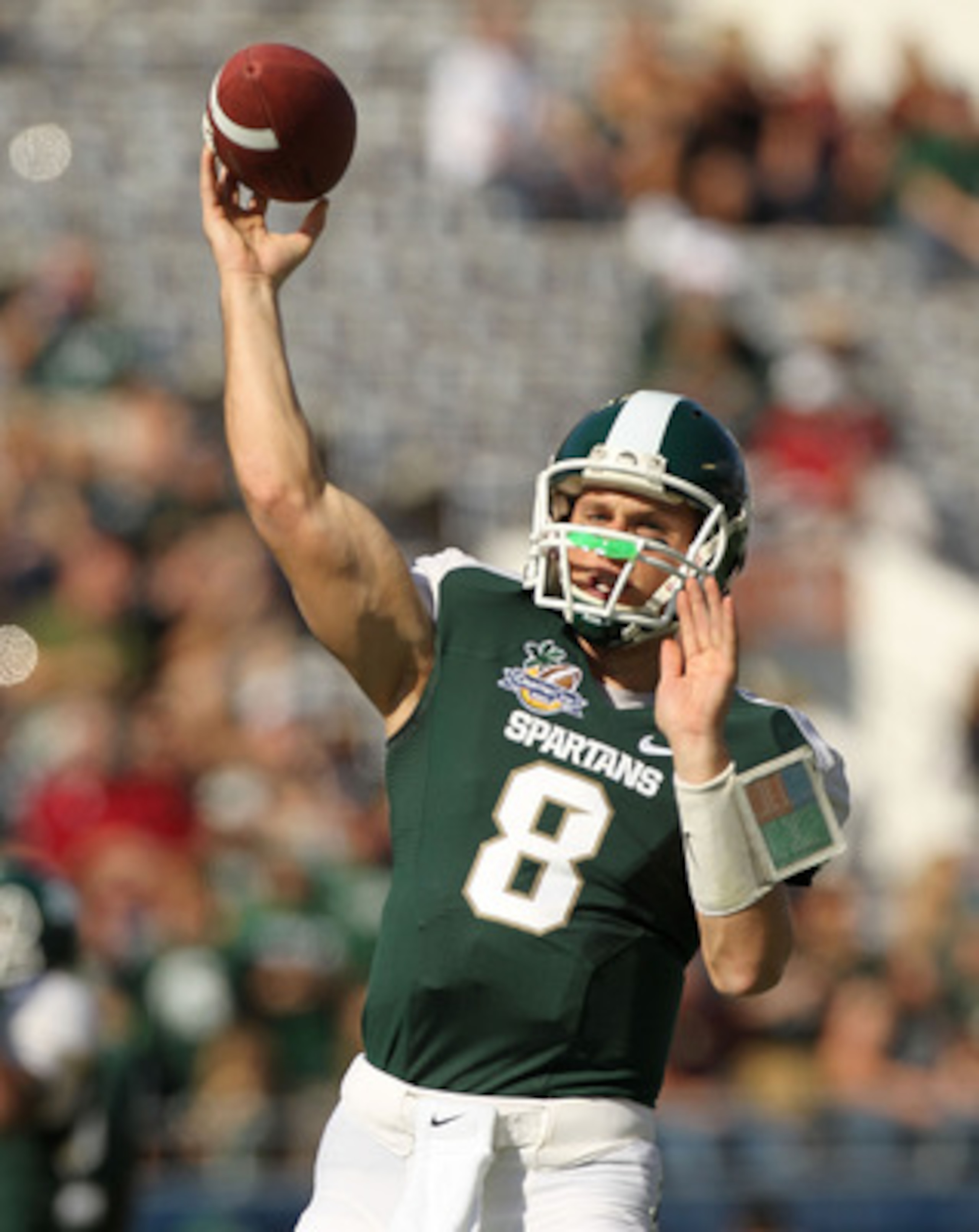 ORLANDO, FL - JANUARY 01: Kirk Cousins #8  of the Michigan State Spartans warms up during the Capitol One Bowl against the Alabama Crimson Tide at the Florida Citrus Bowl on January 1, 2011 in Orlando, Florida.  (Photo by Mike Ehrmann/Getty Images)