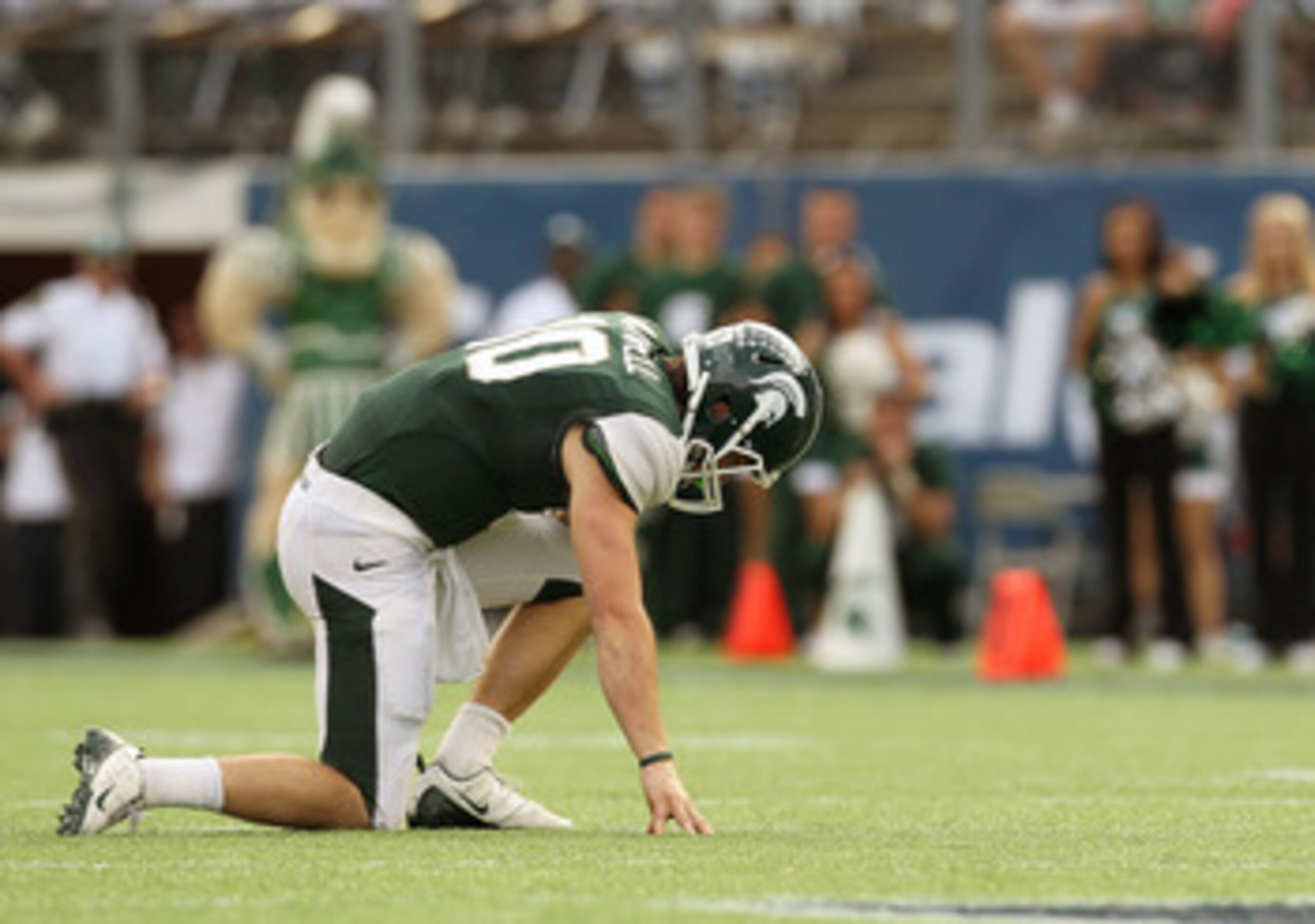 ORLANDO, FL - JANUARY 01:  Andrew Maxwell #10 of the Michigan State Spartans is shaken up on a play during the Capitol One Bowl against the Alabama Crimson Tide at the Florida Citrus Bowl on January 1, 2011 in Orlando, Florida.  (Photo by Mike Ehrmann/Get