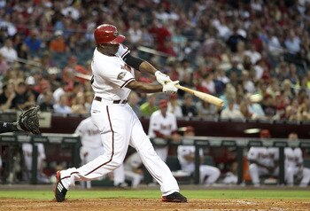 PHOENIX, AZ - JUNE 14:  Justin Upton #10 of the Arizona Diamondbacks hits a single against the San Francisco Giants during the fourth inning of the Major League Baseball game at Chase Field on June 14, 2011 in Phoenix, Arizona.  (Photo by Christian Peters