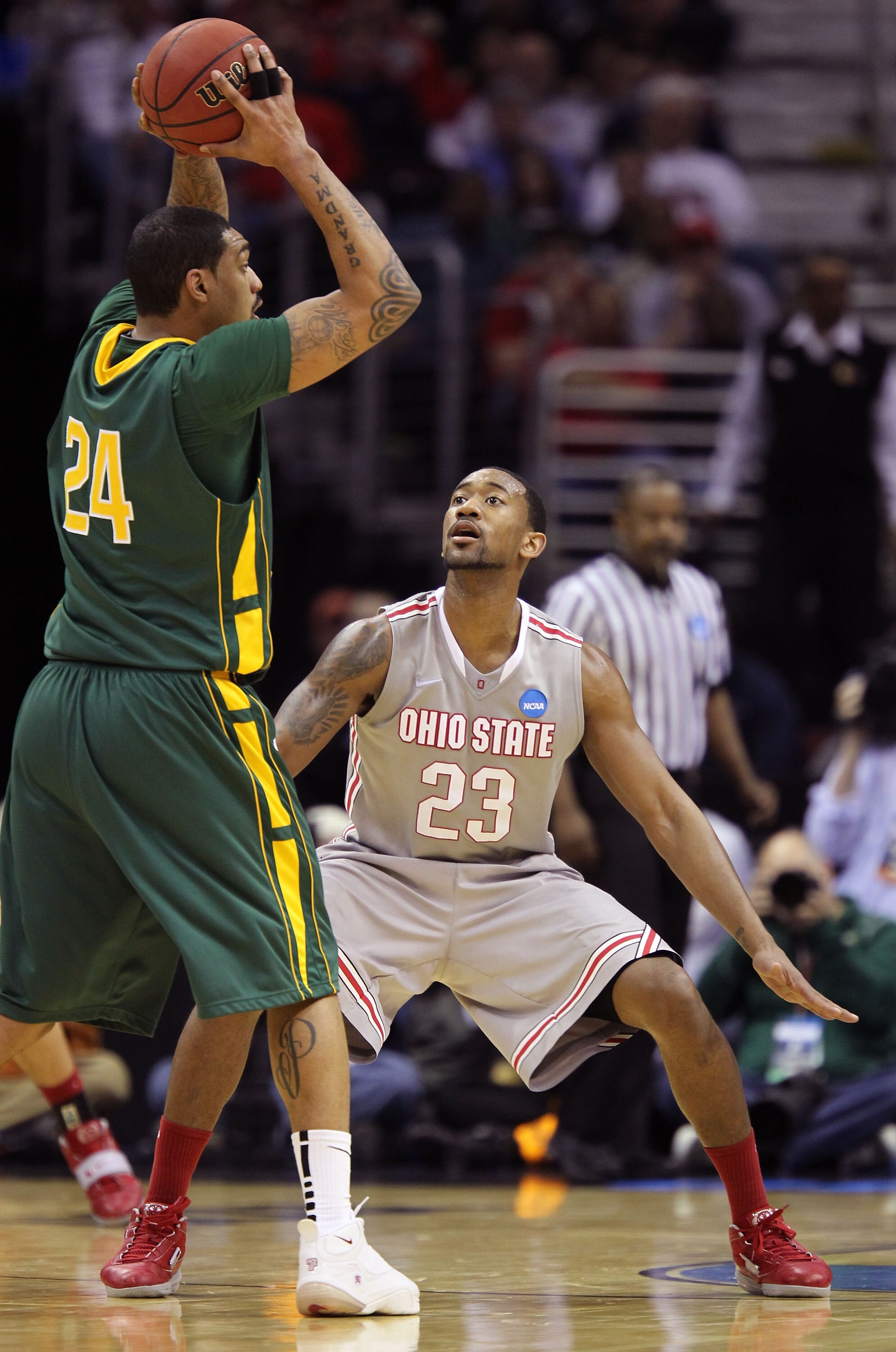 CLEVELAND, OH - MARCH 20: David Lighty #23 of the Ohio State Buckeyes defends Ryan Pearson #24 of the George Mason Patriots during the third of the 2011 NCAA men's basketball tournament at Quicken Loans Arena on March 20, 2011 in Cleveland, Ohio. (Photo CLEVELAND, OH - MARCH 20: David Lighty #23 of the Ohio State Buckeyes defends Ryan Pearson #24 of the George Mason Patriots during the third of the 2011 NCAA men's basketball tournament at Quicken Loans Arena on March 20, 2011 in Cleveland, Ohio. (Photo