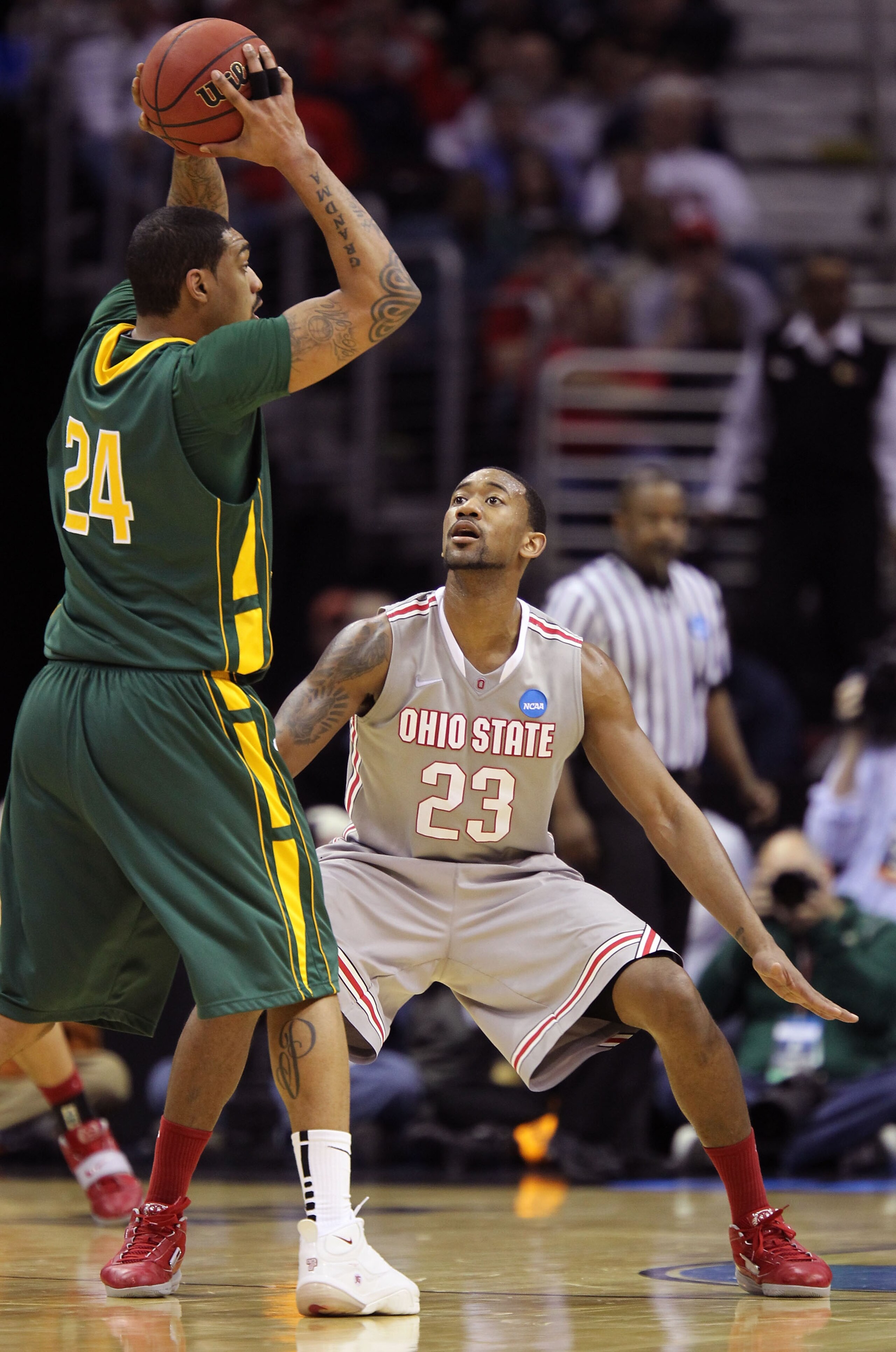 CLEVELAND, OH - MARCH 20: David Lighty #23 of the Ohio State Buckeyes defends Ryan Pearson #24 of the George Mason Patriots during the third of the 2011 NCAA men's basketball tournament at Quicken Loans Arena on March 20, 2011 in Cleveland, Ohio. (Photo CLEVELAND, OH - MARCH 20: David Lighty #23 of the Ohio State Buckeyes defends Ryan Pearson #24 of the George Mason Patriots during the third of the 2011 NCAA men's basketball tournament at Quicken Loans Arena on March 20, 2011 in Cleveland, Ohio. (Photo