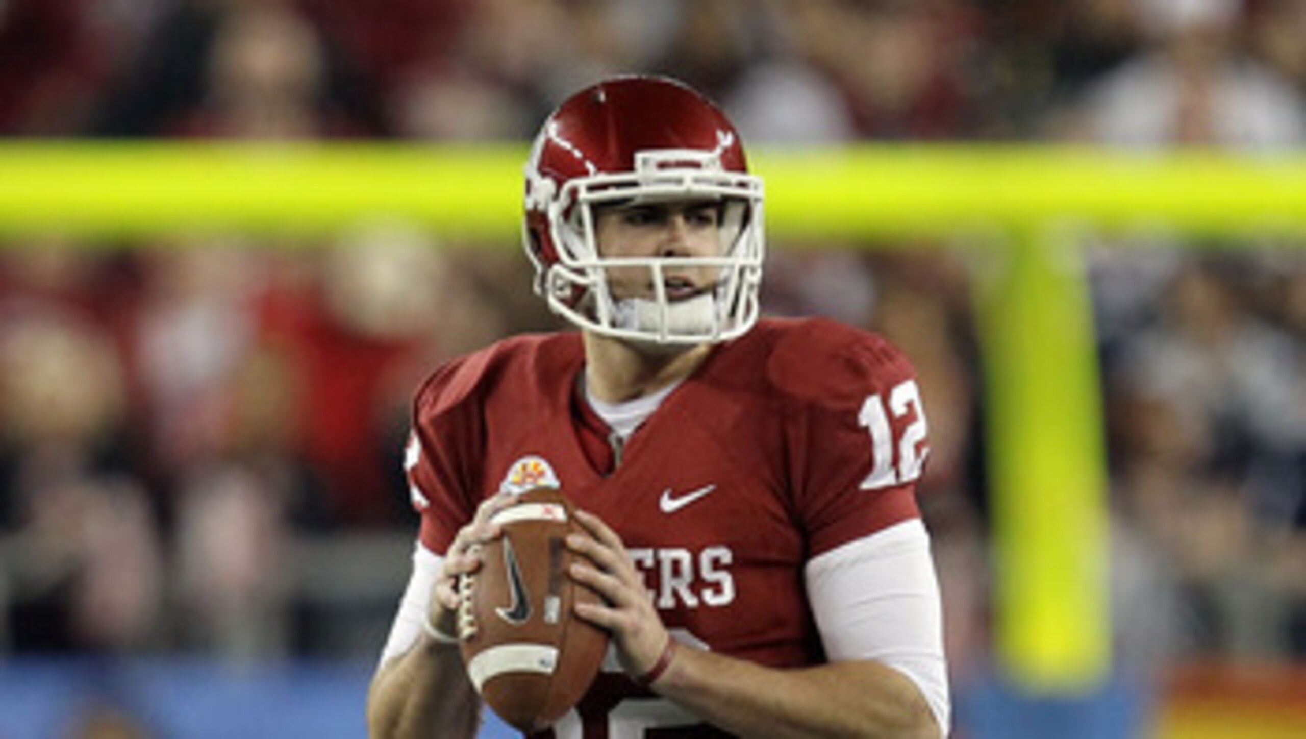 GLENDALE, AZ - JANUARY 01:  Landry Jones #12 of the Oklahoma Sooners looks to throw the ball against the Connecticut Huskies during the Tostitos Fiesta Bowl at the Universtity of Phoenix Stadium on January 1, 2011 in Glendale, Arizona.  (Photo by Ronald M