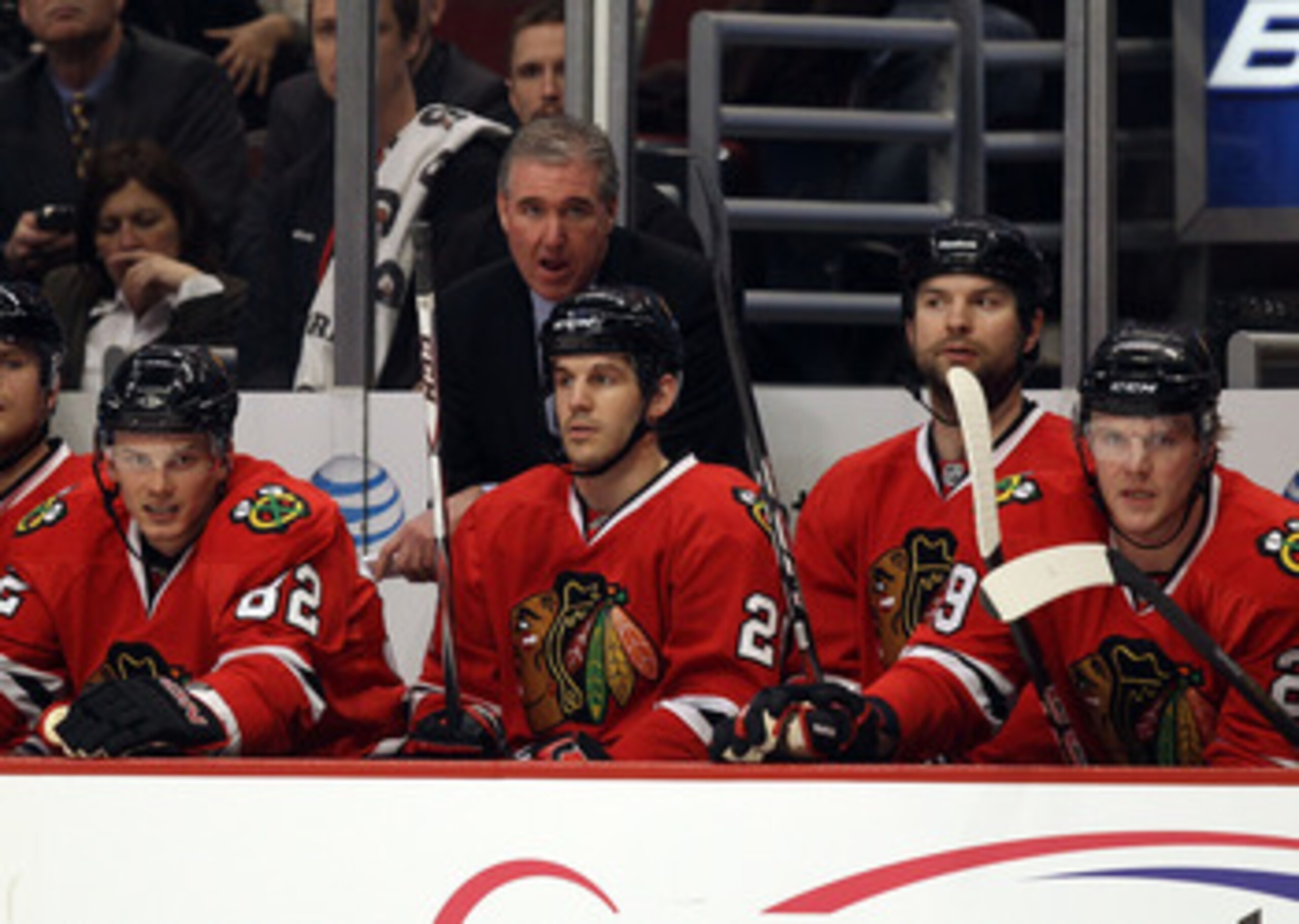 CHICAGO, IL - FEBRUARY 16: Assistant coach Mike Haviland of the Chicago Blackhawks, acting as head coach in place of Joel Quenneville, who is ill, watches the action with players including Tomas Kopecky #82 and Jake Dowell #28 against the Minnesota Wild a