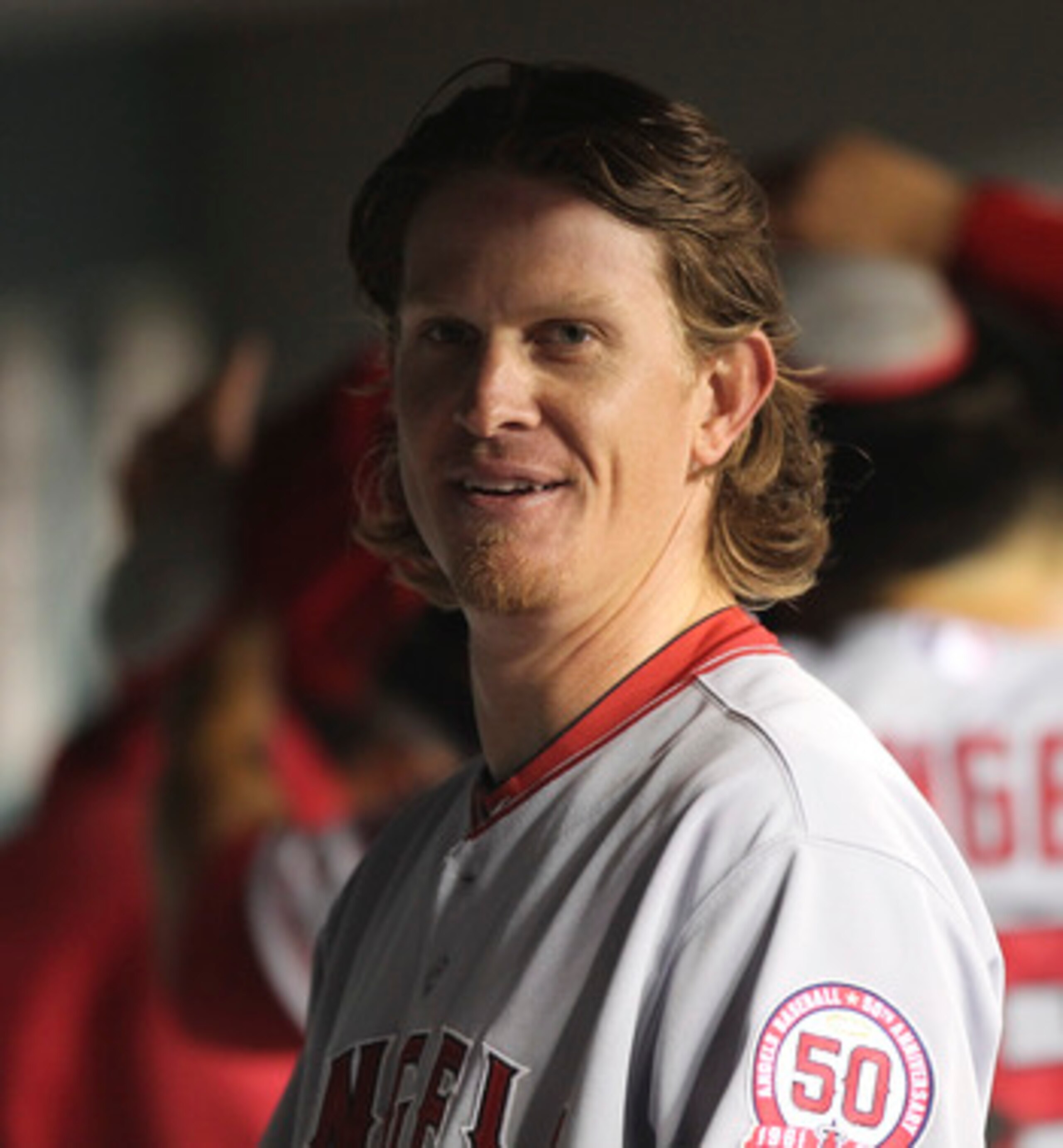 SEATTLE - JUNE 14:  Starting pitcher Jered Weaver #36 of the Los Angeles Angels of Anaheim smiles in the dugout at the end of the seventh inning against the Seattle Mariners at Safeco Field on June 14, 2011 in Seattle, Washington. Weaver threw a complete