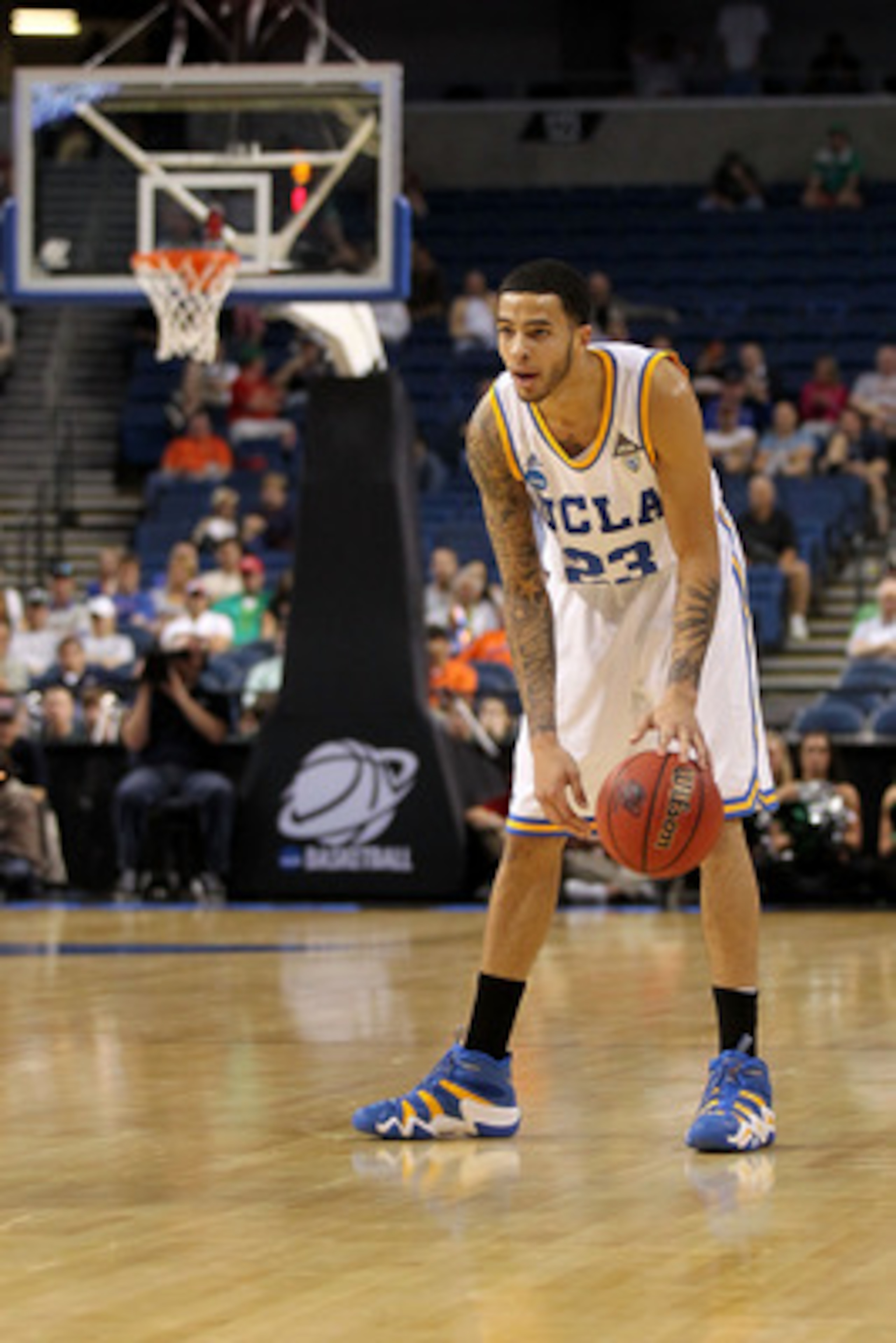 TAMPA, FL - MARCH 17: Tyler Honeycutt #23 of the UCLA Bruins looks to pass the ball against the Michigan State Spartans during the second round of the 2011 NCAA men's basketball tournament at St. Pete Times Forum on March 17, 2011 in Tampa, Florida. UCLA TAMPA, FL - MARCH 17: Tyler Honeycutt #23 of the UCLA Bruins looks to pass the ball against the Michigan State Spartans during the second round of the 2011 NCAA men's basketball tournament at St. Pete Times Forum on March 17, 2011 in Tampa, Florida. UCLA