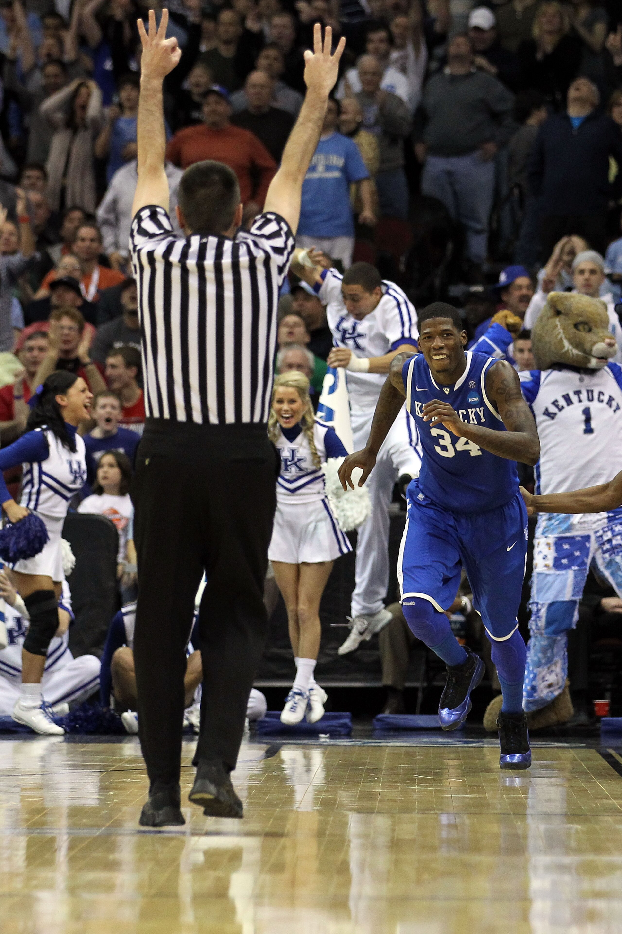 NEWARK, NJ - MARCH 27: DeAndre Liggins #34 of the Kentucky Wildcats celebrates after shooting a three pointer against the North Carolina Tar Heels during the second half of the east regional final of the 2011 NCAA men's basketball tournament at Prudentia NEWARK, NJ - MARCH 27: DeAndre Liggins #34 of the Kentucky Wildcats celebrates after shooting a three pointer against the North Carolina Tar Heels during the second half of the east regional final of the 2011 NCAA men's basketball tournament at Prudentia