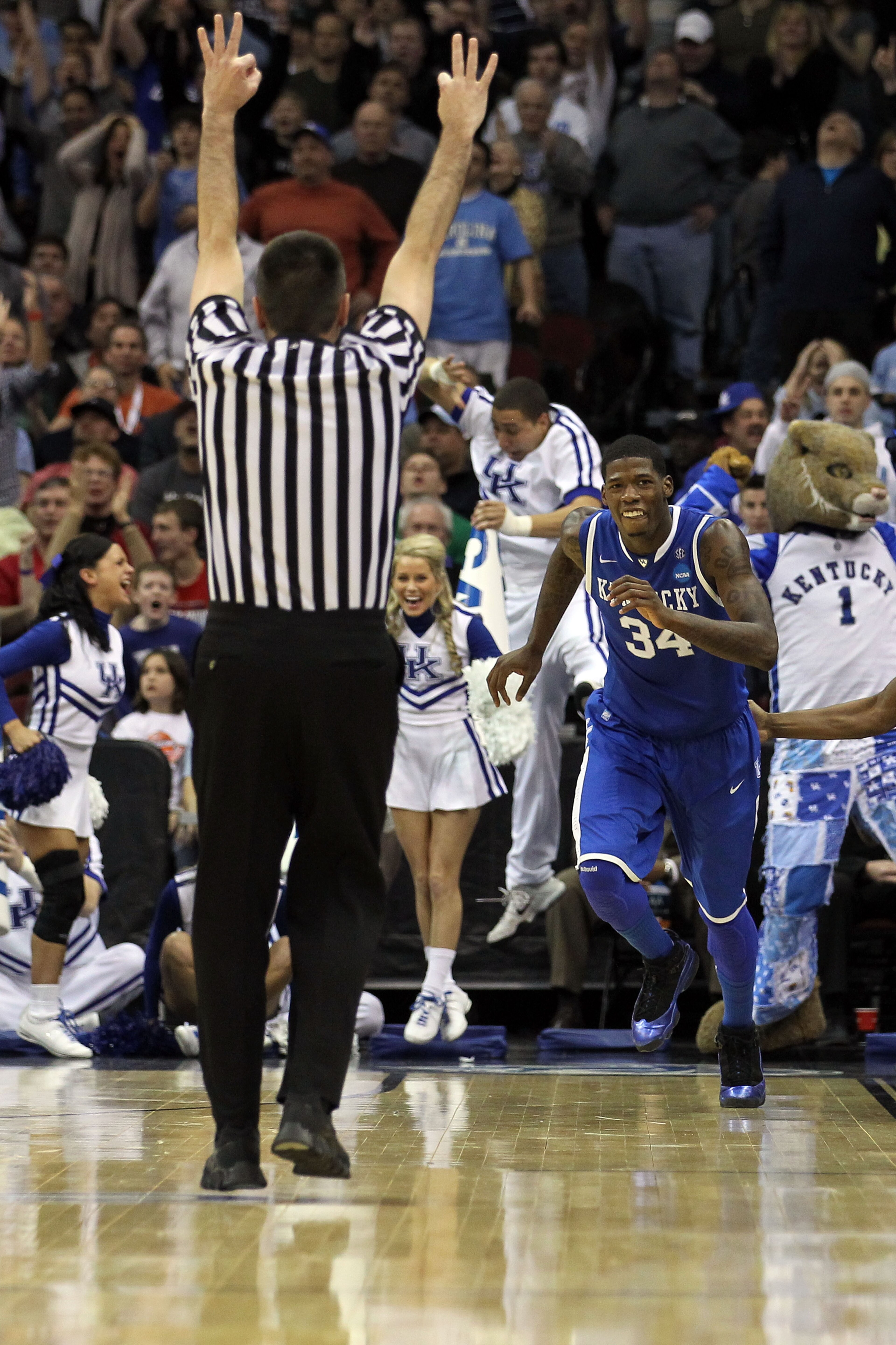 NEWARK, NJ - MARCH 27:  DeAndre Liggins #34 of the Kentucky Wildcats celebrates after shooting a three pointer against the North Carolina Tar Heels during the second half of the east regional final of the 2011 NCAA men's basketball tournament at Prudentia