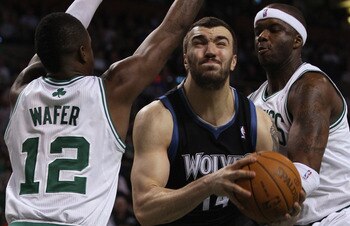 BOSTON, MA - JANUARY 03:  Nikola Pekovic #14 of the Minnesota Timberwolves tries to get between Von Wafer #12 and Jermaine O'Neal #7 of the Boston Celtics on January 3, 2011 at the TD Garden in Boston, Massachusetts. The Celtics defeated the Timberwolves