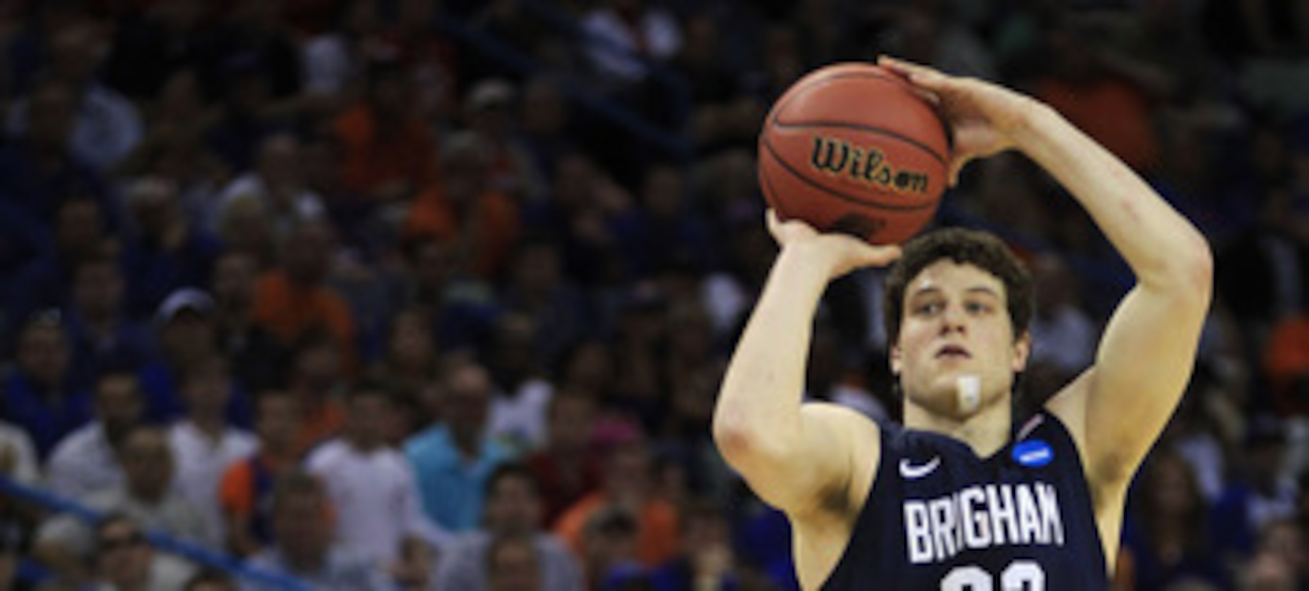 NEW ORLEANS, LA - MARCH 24:  Jimmer Fredette #32 of the Brigham Young Cougars shoots over Scottie Wilbekin #5 of the Florida Gators in the second half during the Southeast regional of the 2011 NCAA men's basketball tournament at New Orleans Arena on March