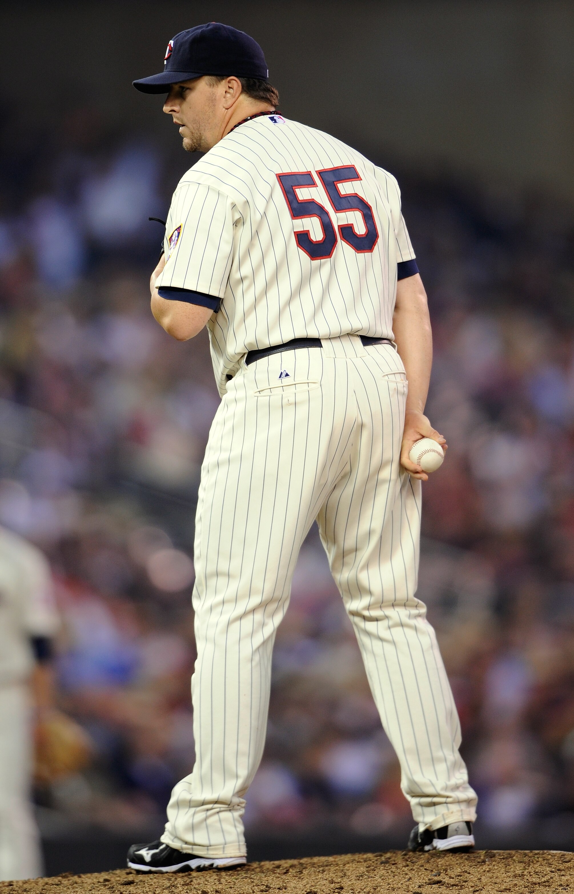 MINNEAPOLIS, MN - JUNE 18: Matt Capps #55 of the Minnesota Twins prepares to deliver a pitch against the San Diego Padres in the ninth inning against the San Diego Padres in  on June 18, 2011 at Target Field in Minneapolis, Minnesota. The Twins defeated t