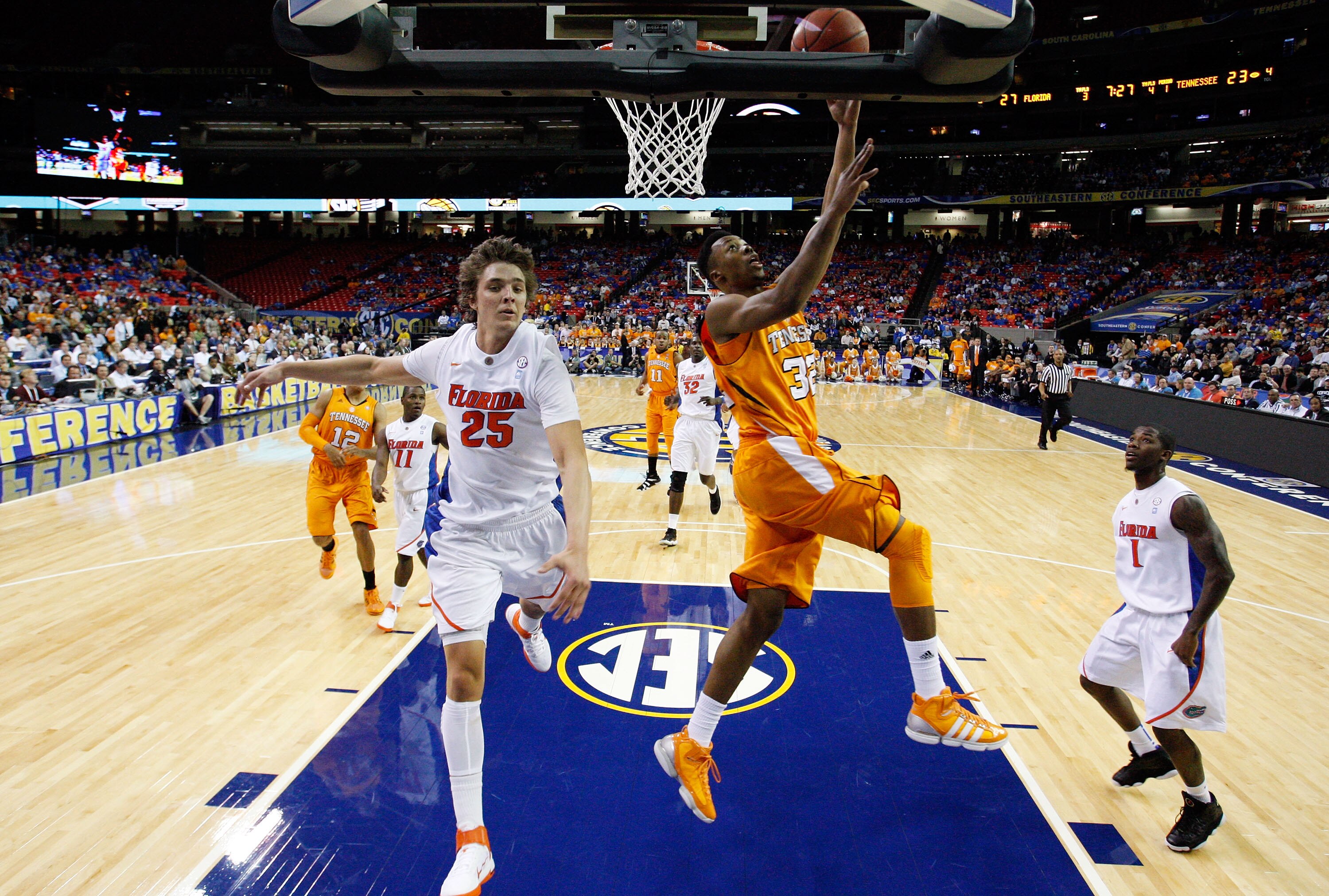 ATLANTA, GA - MARCH 11: Scotty Hopson #32 of the Tennessee Volunteers shoots infront of Chandler Parsons #25 of the Florida Gators during the quarterfinals of the SEC Men's Basketball Tournament at Georgia Dome on March 11, 2011 in Atlanta, Georgia. (Ph ATLANTA, GA - MARCH 11: Scotty Hopson #32 of the Tennessee Volunteers shoots infront of Chandler Parsons #25 of the Florida Gators during the quarterfinals of the SEC Men's Basketball Tournament at Georgia Dome on March 11, 2011 in Atlanta, Georgia. (Ph