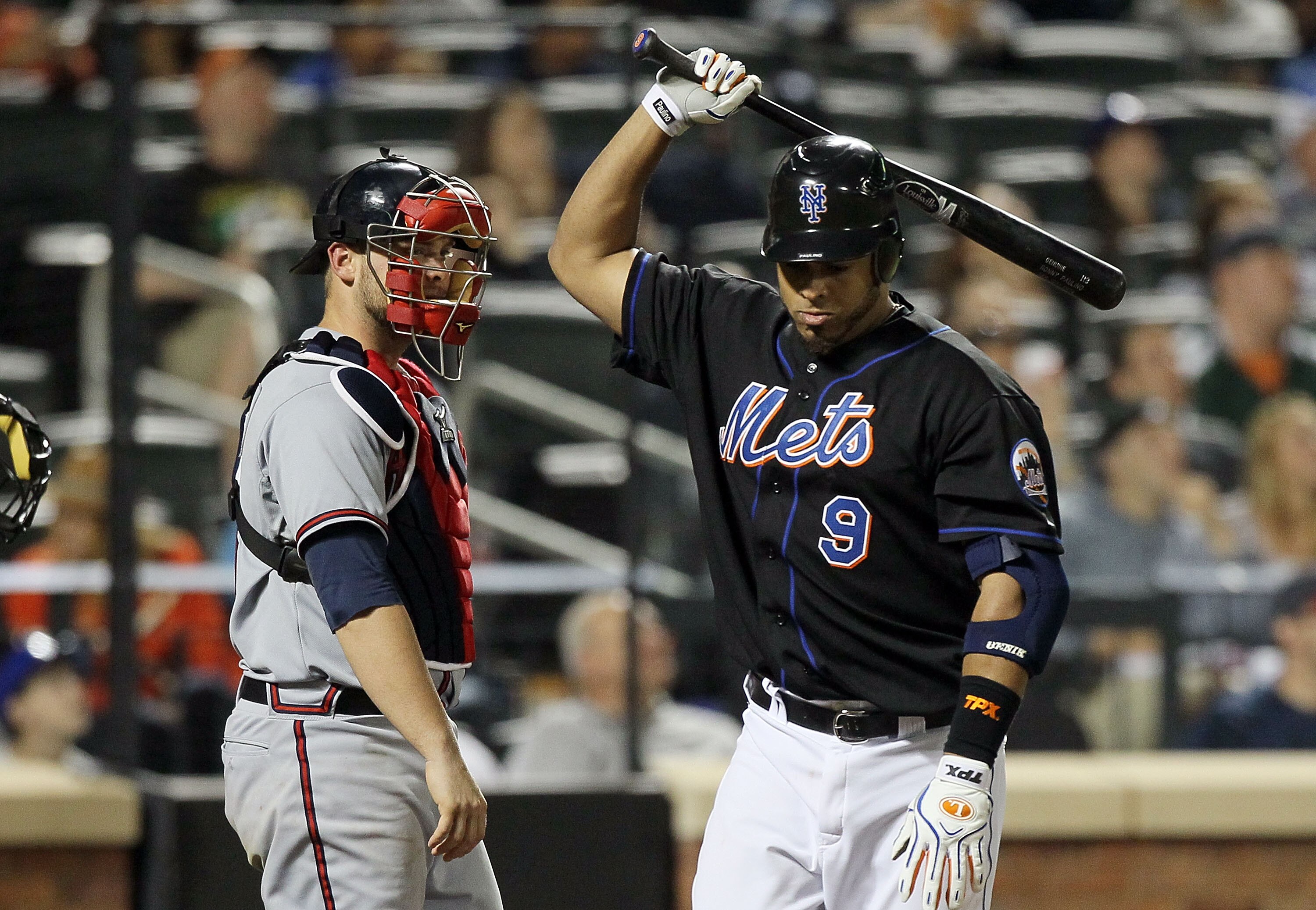 NEW YORK, NY - JUNE 05:  Ronny Paulino #9 of the New York Mets reacts after popping out in the fifth inning with no outs and the bases loaded as Brian McCann #16 of the Atlanta Braves looks on on June 5, 2011 at Citi Field in the Flushing neighborhood of 