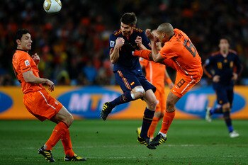 JOHANNESBURG, SOUTH AFRICA - JULY 11:  Nigel De Jong of the Netherlands tackles Xabi Alonso of Spain during the 2010 FIFA World Cup South Africa Final match between Netherlands and Spain at Soccer City Stadium on July 11, 2010 in Johannesburg, South Afric