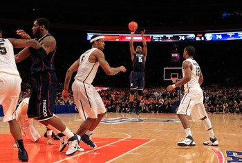 NEW YORK, NY - MARCH 10: Kemba Walker #15 of the Connecticut Huskies shoots a game winning basket against the Pittsburgh Panthers during the quarterfinals of the 2011 Big East Men's Basketball Tournament presented by American Eagle Outfitters  at Madison 