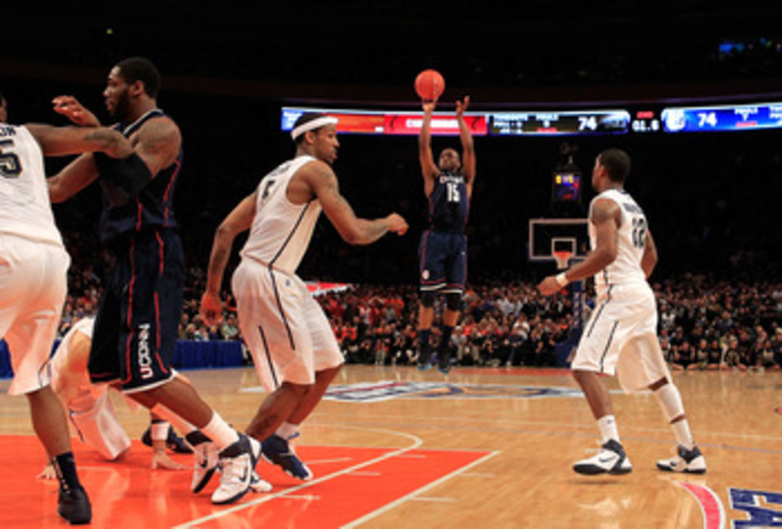 NEW YORK, NY - MARCH 10: Kemba Walker #15 of the Connecticut Huskies shoots a game winning basket against the Pittsburgh Panthers during the quarterfinals of the 2011 Big East Men's Basketball Tournament presented by American Eagle Outfitters  at Madison 