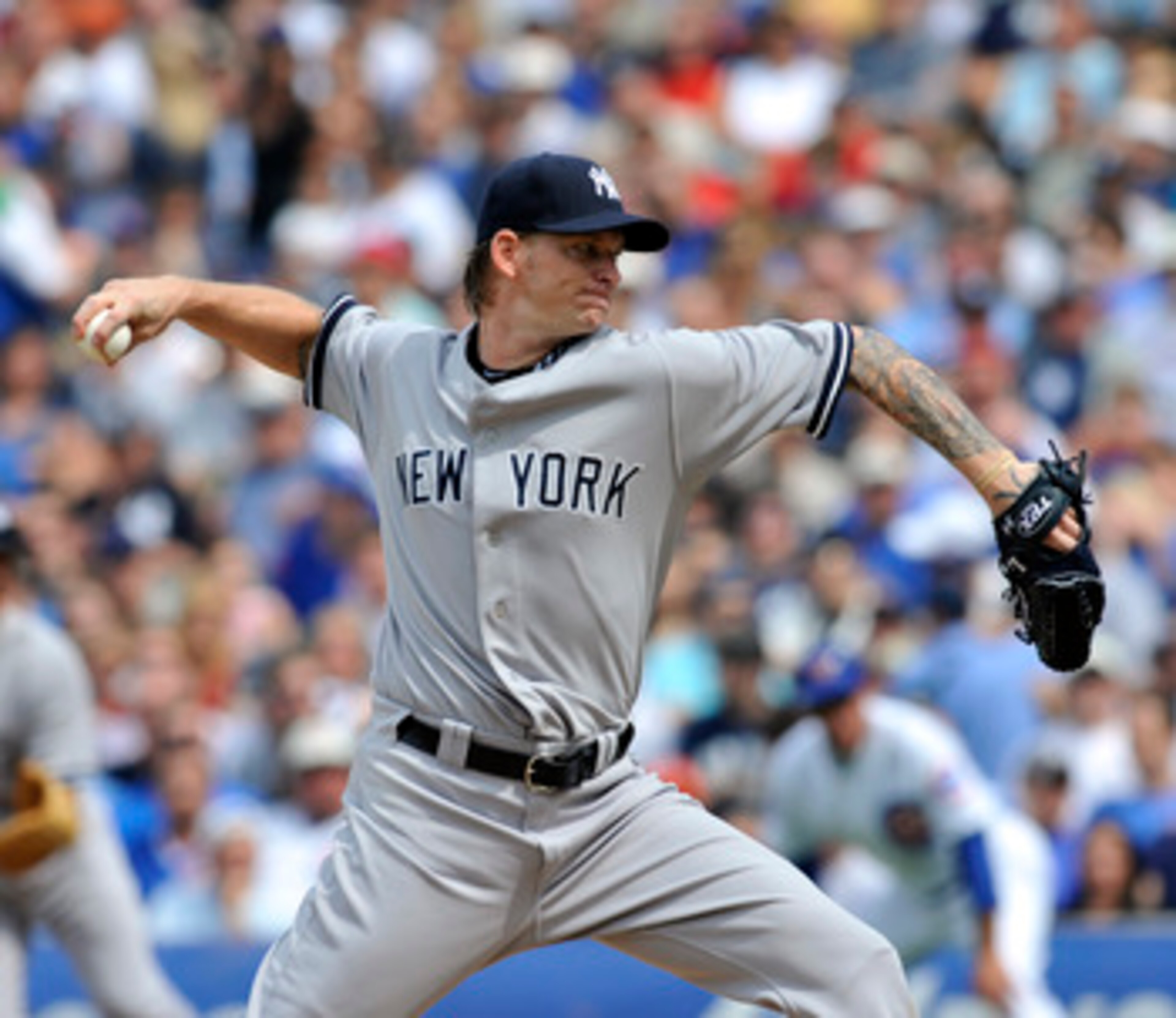 CHICAGO, IL - JUNE 18: A.J. Burnett # 34 of the New York Yankees pitches against the Chicago Cubs on June 18, 2011 at Wrigley Field in Chicago, Illinois. (Photo by David Banks/Getty Images) CHICAGO, IL - JUNE 18: A.J. Burnett # 34 of the New York Yankees pitches against the Chicago Cubs on June 18, 2011 at Wrigley Field in Chicago, Illinois. (Photo by David Banks/Getty Images)