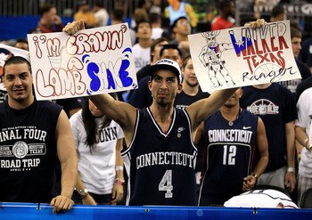 HOUSTON, TX - APRIL 04:  A Connecticut Huskies fan holds up signs before the Huskies take on the Butler Bulldogs in the National Championship Game of the 2011 NCAA Division I Men's Basketball Tournament at Reliant Stadium on April 4, 2011 in Houston, Texa
