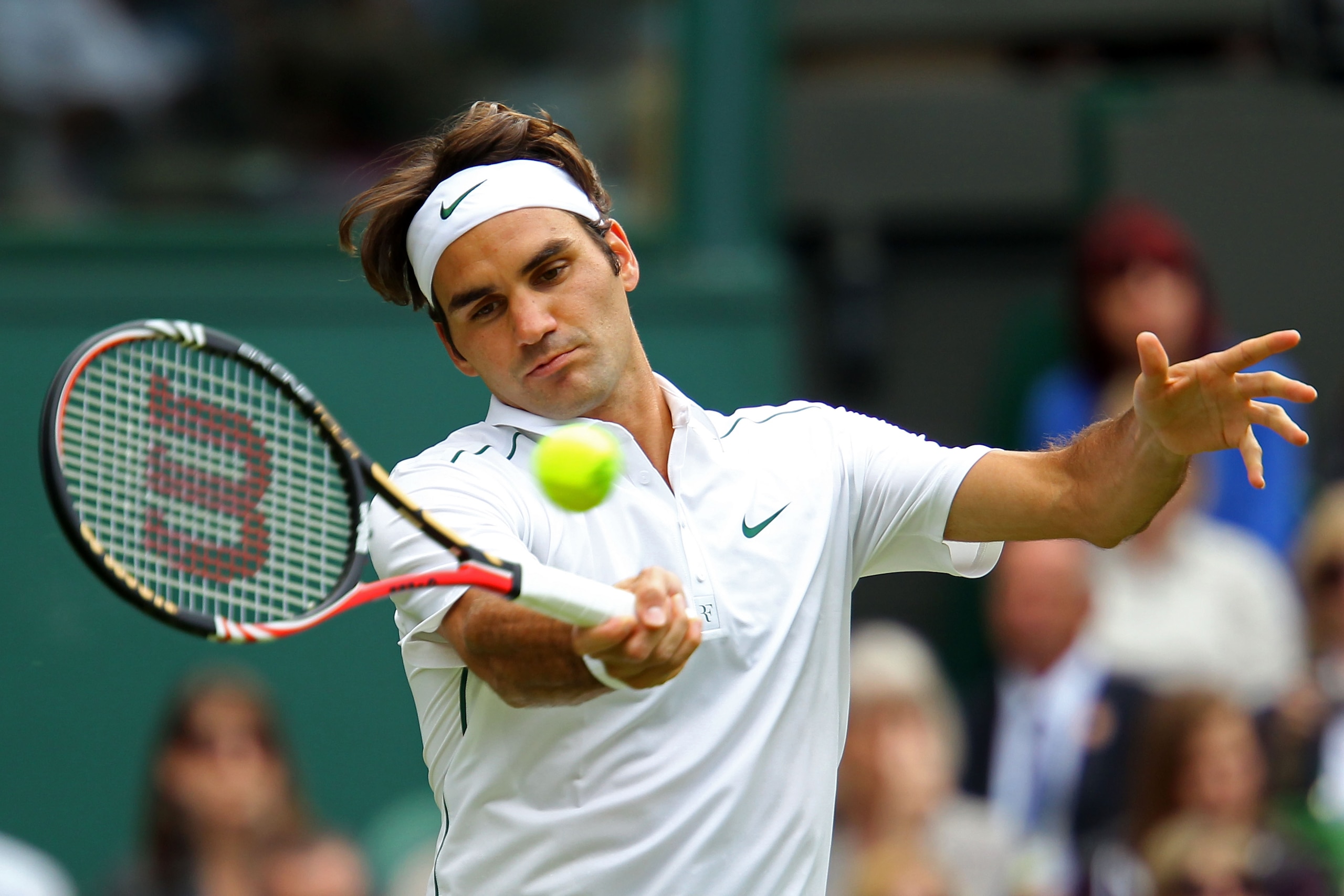 LONDON, ENGLAND - JUNE 21: Roger Federer of Switzerland returns a shot during his first round match against Mikhail Kukushkin of Kazakhstan on Day Two of the Wimbledon Lawn Tennis Championships at the All England Lawn Tennis and Croquet Club on June 21, LONDON, ENGLAND - JUNE 21: Roger Federer of Switzerland returns a shot during his first round match against Mikhail Kukushkin of Kazakhstan on Day Two of the Wimbledon Lawn Tennis Championships at the All England Lawn Tennis and Croquet Club on June 21,