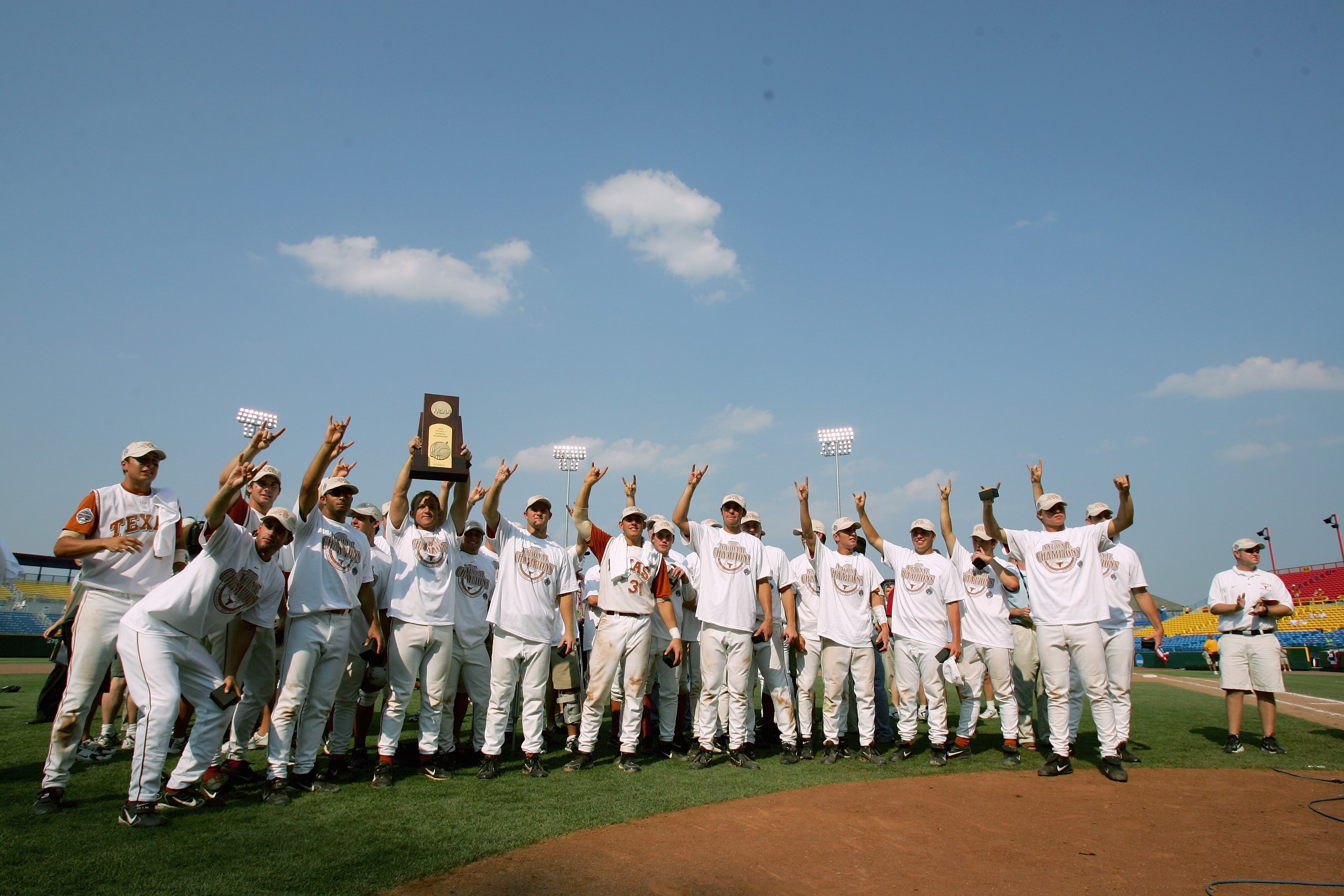 OMAHA, NE - JUNE 26:  Members of the Texas Longhorns celebrate after defeating the Florida Gators 6-2 during Game 2 of the championship series of the 59th College World Series at Rosenblatt Stadium on June 26, 2005 in Omaha, Nebraska.  (Photo by Jed Jacob