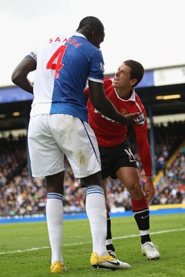 BLACKBURN, ENGLAND - MAY 14:  Javier Hernandez (R) of Manchester United looks upto to Chris Samba (L) of Blackburn Rovers after being fouled and winning a penalty during the Barclays Premier League match between Blackburn Rovers and Manchester United at E