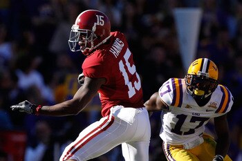 BATON ROUGE, LA - NOVEMBER 06:  Darius Hanks #15 of the Alabama Crimson Tide avoids a tackle by Morris Claiborne #17 of the Louisiana State University Tigers at Tiger Stadium on November 6, 2010 in Baton Rouge, Louisiana.  (Photo by Chris Graythen/Getty I