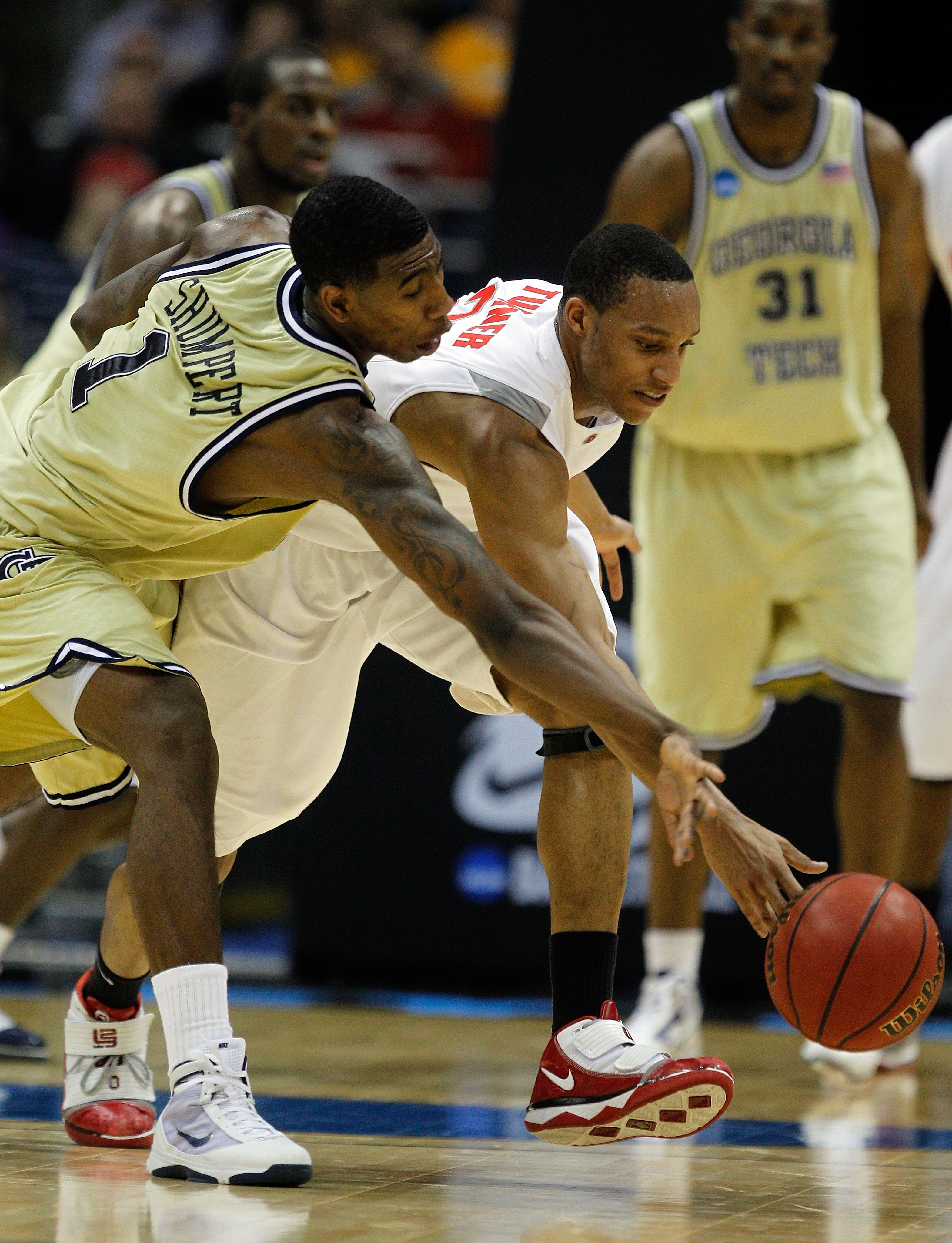 MILWAUKEE - MARCH 21: Iman Shumpert #1 of the Georgia Tech Yellow Jackets and Evan Turner #21 of the Ohio State Buckeyes go after a loose ball during the second round of the 2010 NCAA men's basketball tournament at the Bradley Center on March 21, 2010 in MILWAUKEE - MARCH 21: Iman Shumpert #1 of the Georgia Tech Yellow Jackets and Evan Turner #21 of the Ohio State Buckeyes go after a loose ball during the second round of the 2010 NCAA men's basketball tournament at the Bradley Center on March 21, 2010 in