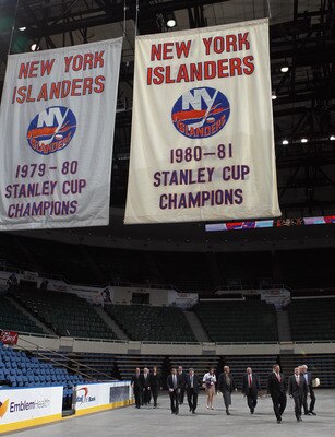UNIONDALE, NY - MAY 11:  New York Islanders owner Charles Wang and Nassau County Executive Edward Mangano arrive to announce a referendum that will build a new arena and keep the Islanders in place through 2045 during a press conference at the Nassau Vete