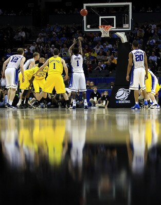 CHARLOTTE, NC - MARCH 20:  Kyrie Irving #1 of the Duke Blue Devils shoots a free throw while taking on the Michigan Wolverines during the third round of the 2011 NCAA men's basketball tournament at Time Warner Cable Arena on March 20, 2011 in Charlotte, N